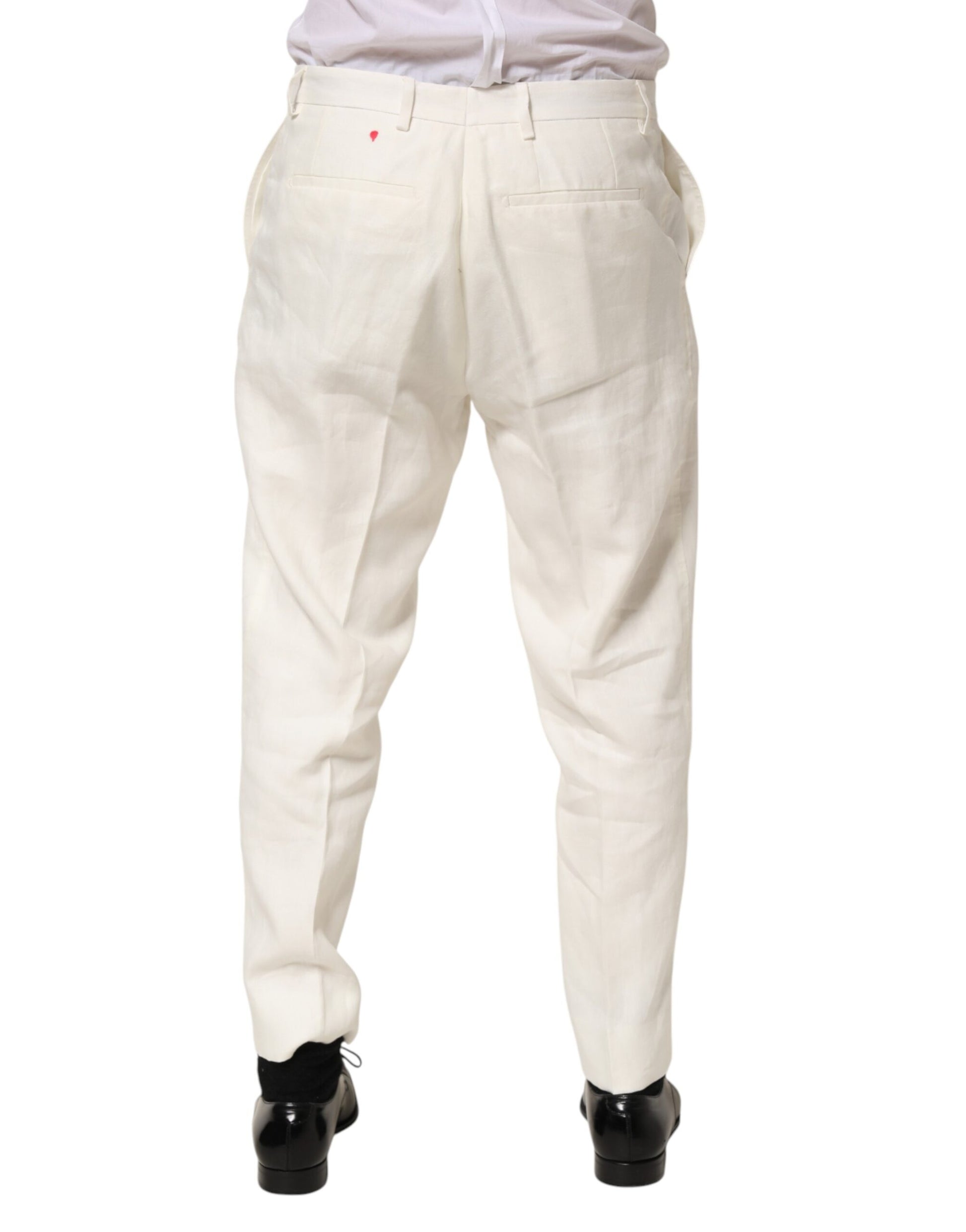 A pair of men's trousers in a light beige color. They appear to be made from linen and have a relaxed fit wit