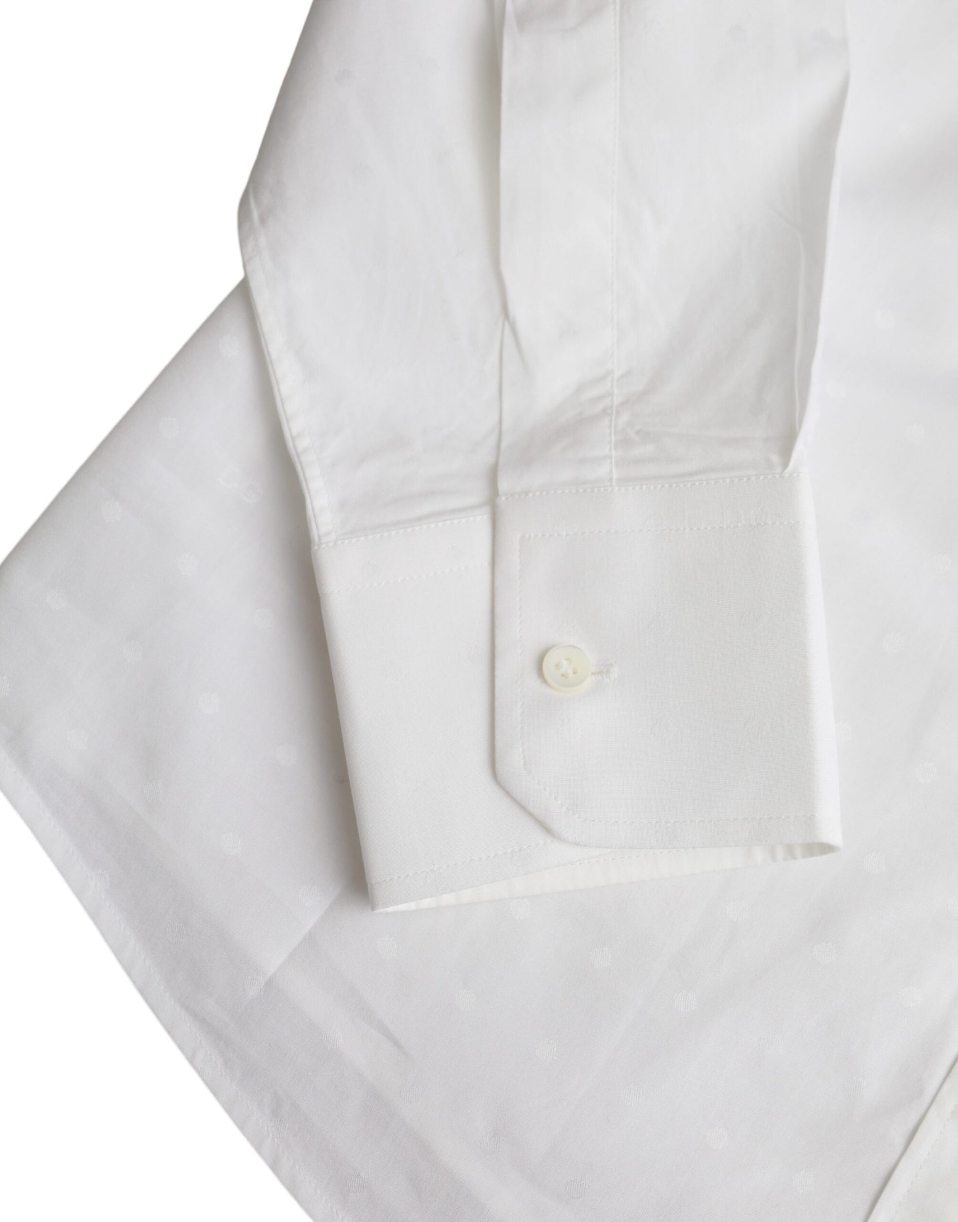 White cotton dress shirt with gold logo, long sleeves, and buttoned cuffs