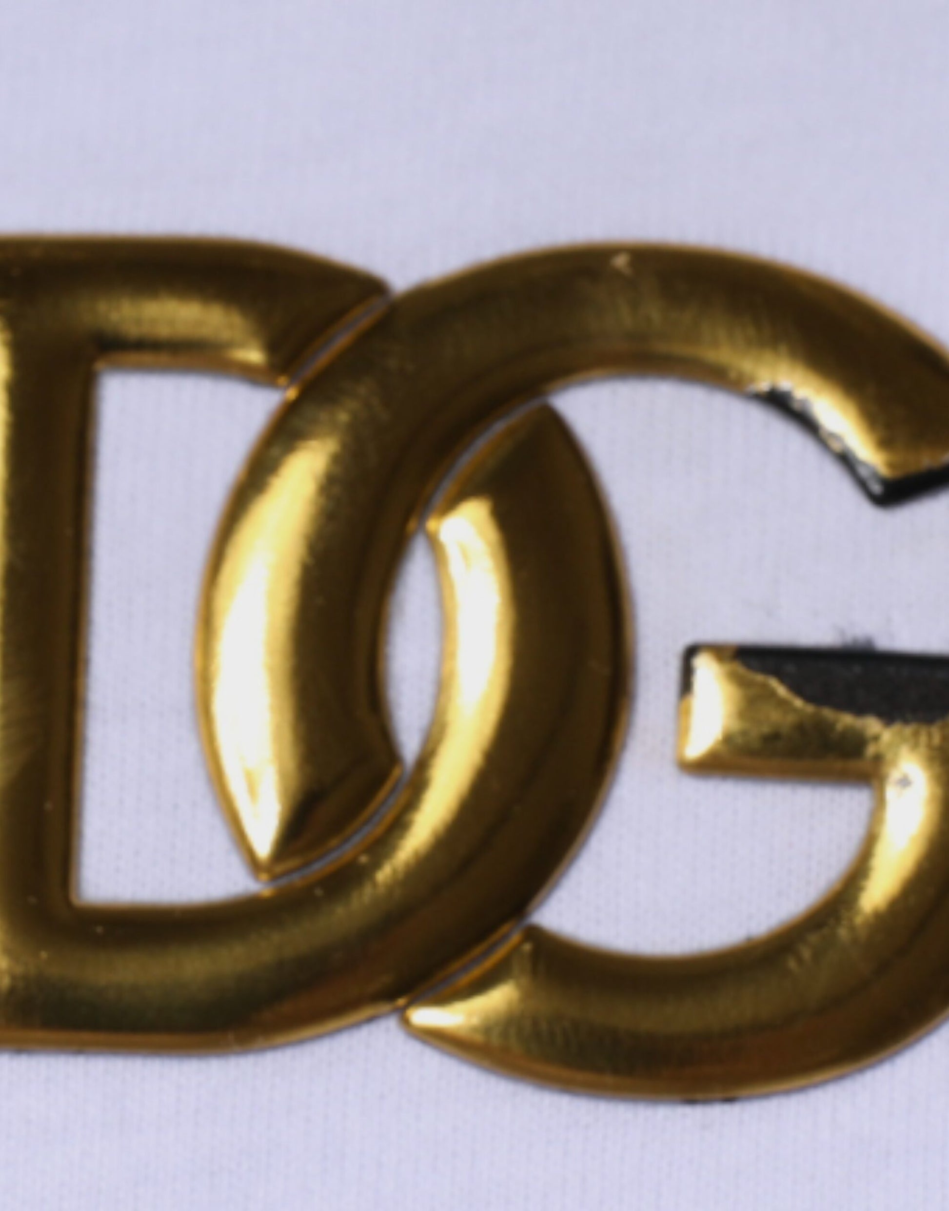 Gold lettered logo on fabric