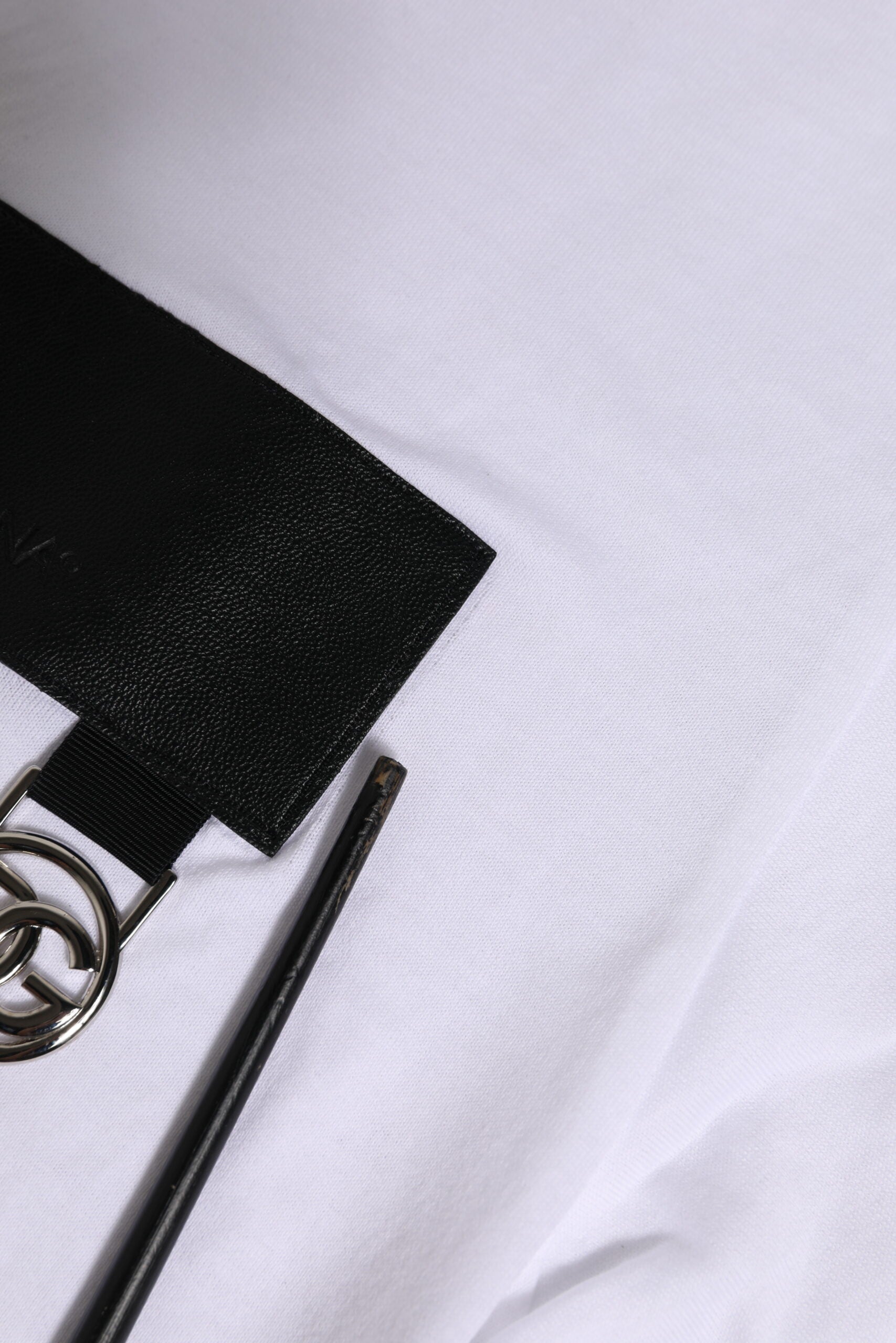 Black pen on white fabric