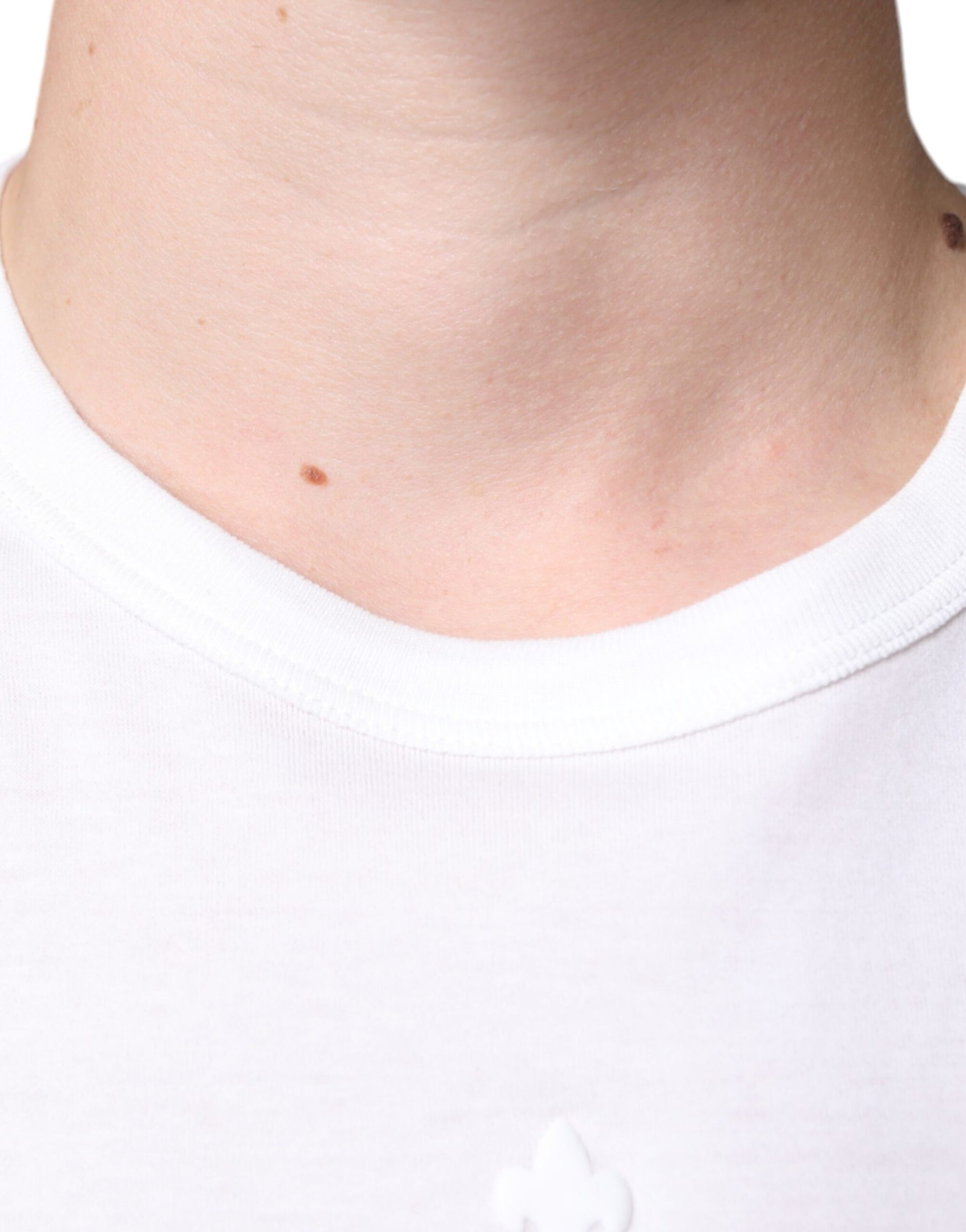 White t-shirt with a logo on the left chest area
