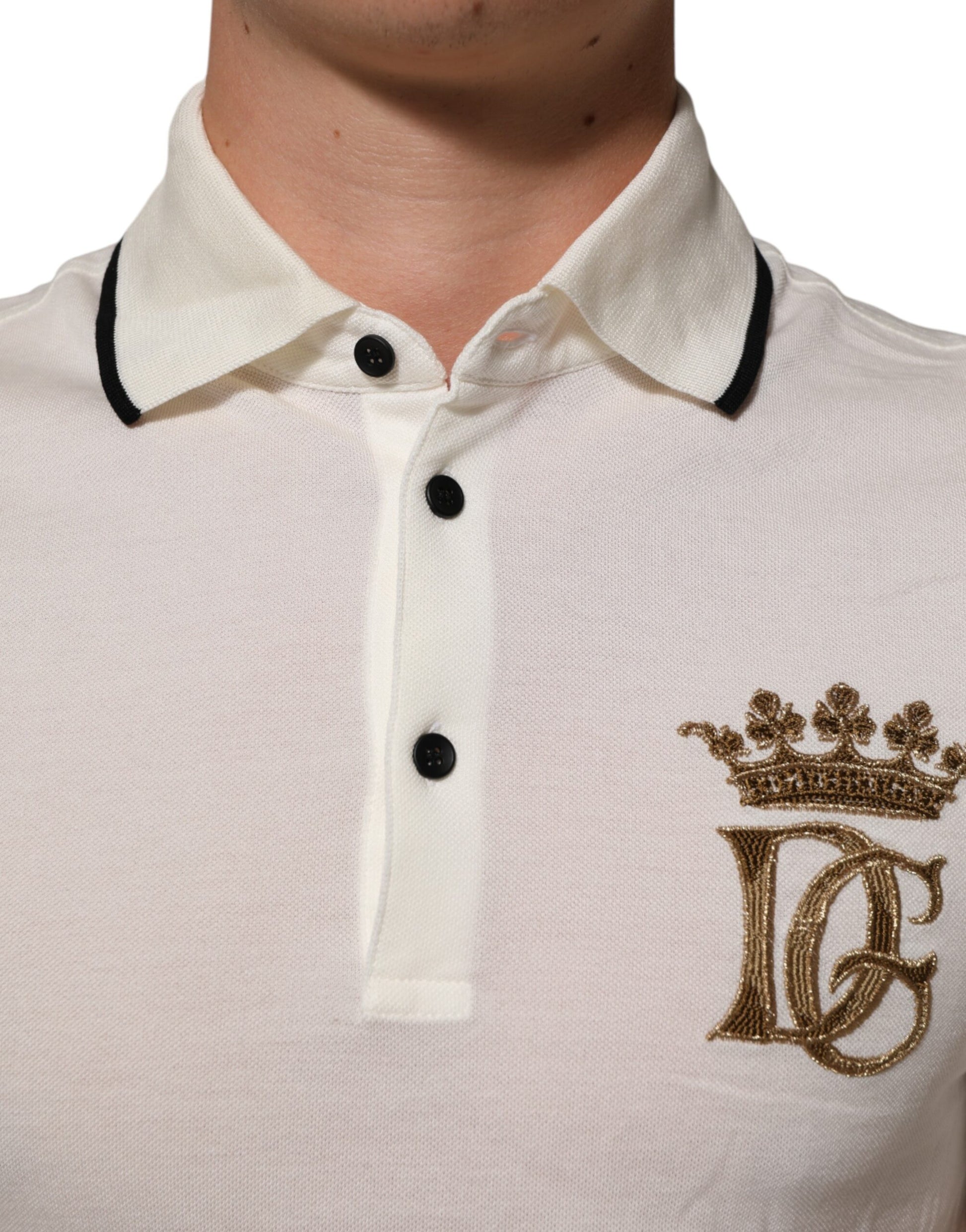 White polo shirt with black collar and gold embroidery on left chest