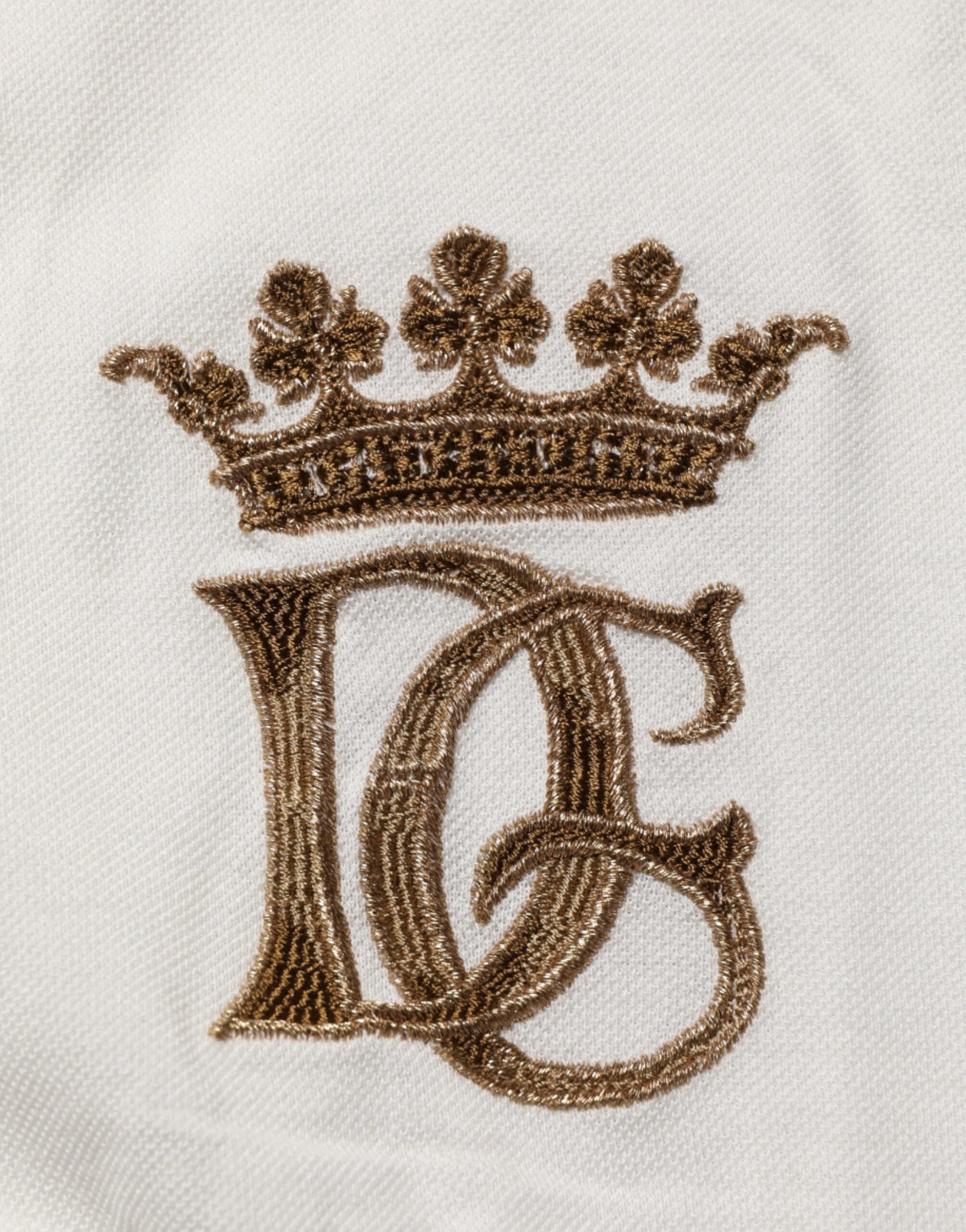 Embroidered monogrammed towel with crown symbol