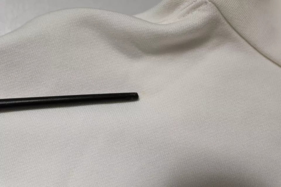 Black pen on white fabric