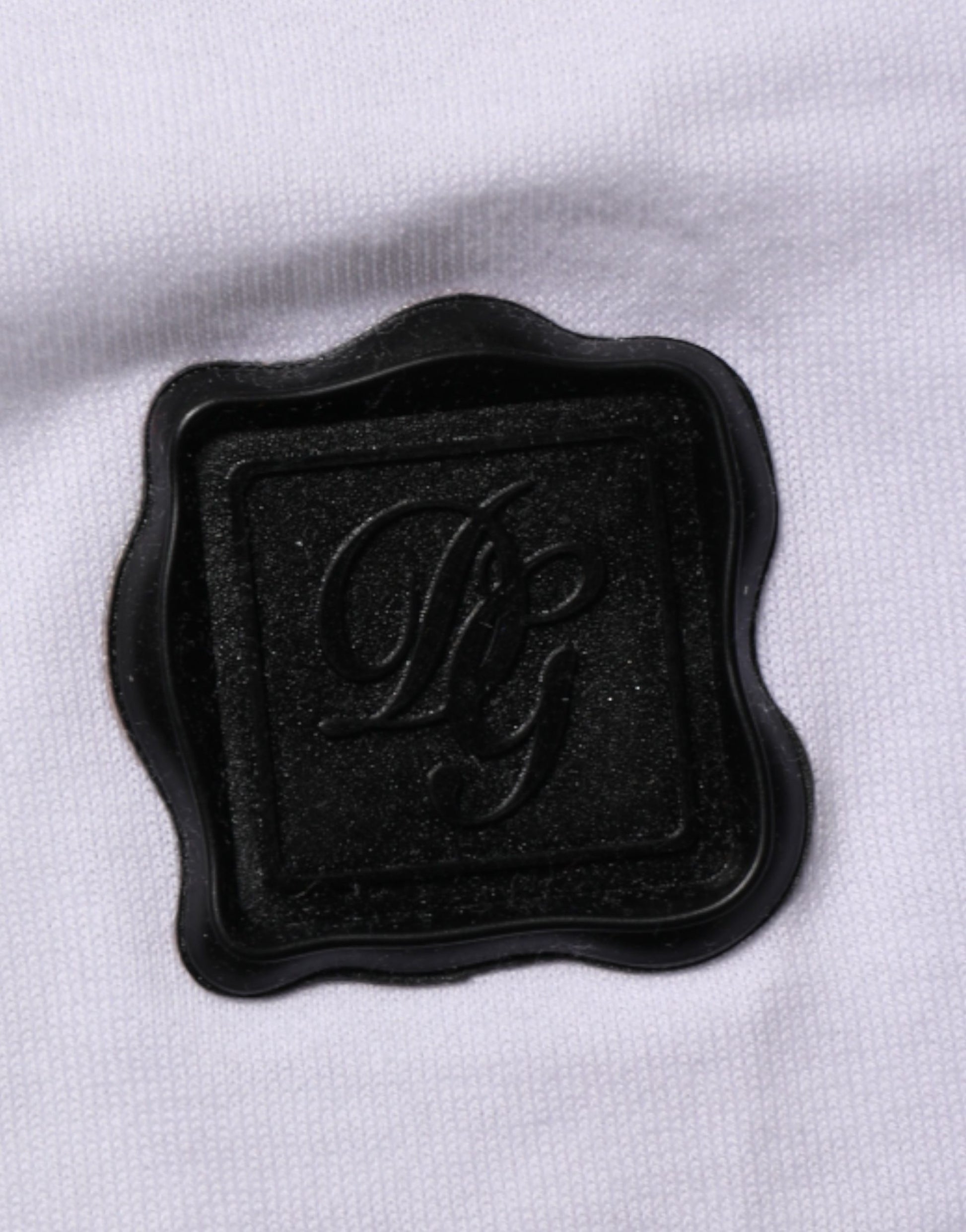 Black logo on white fabric