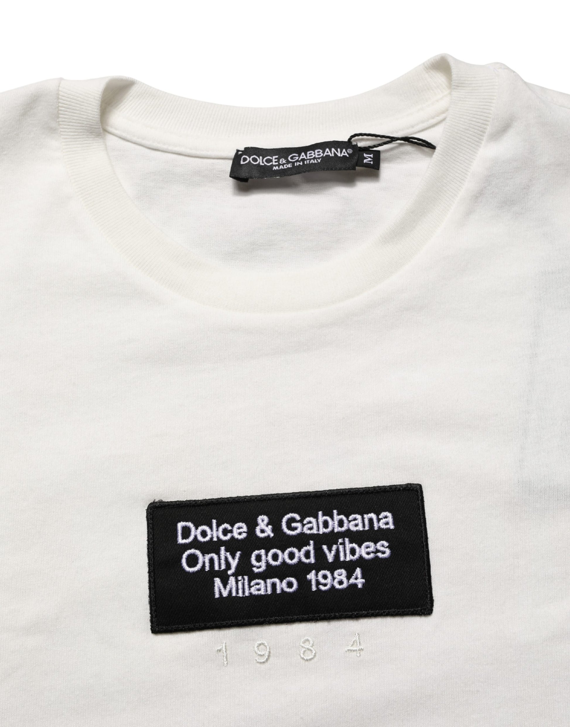 White t-shirt with black text label