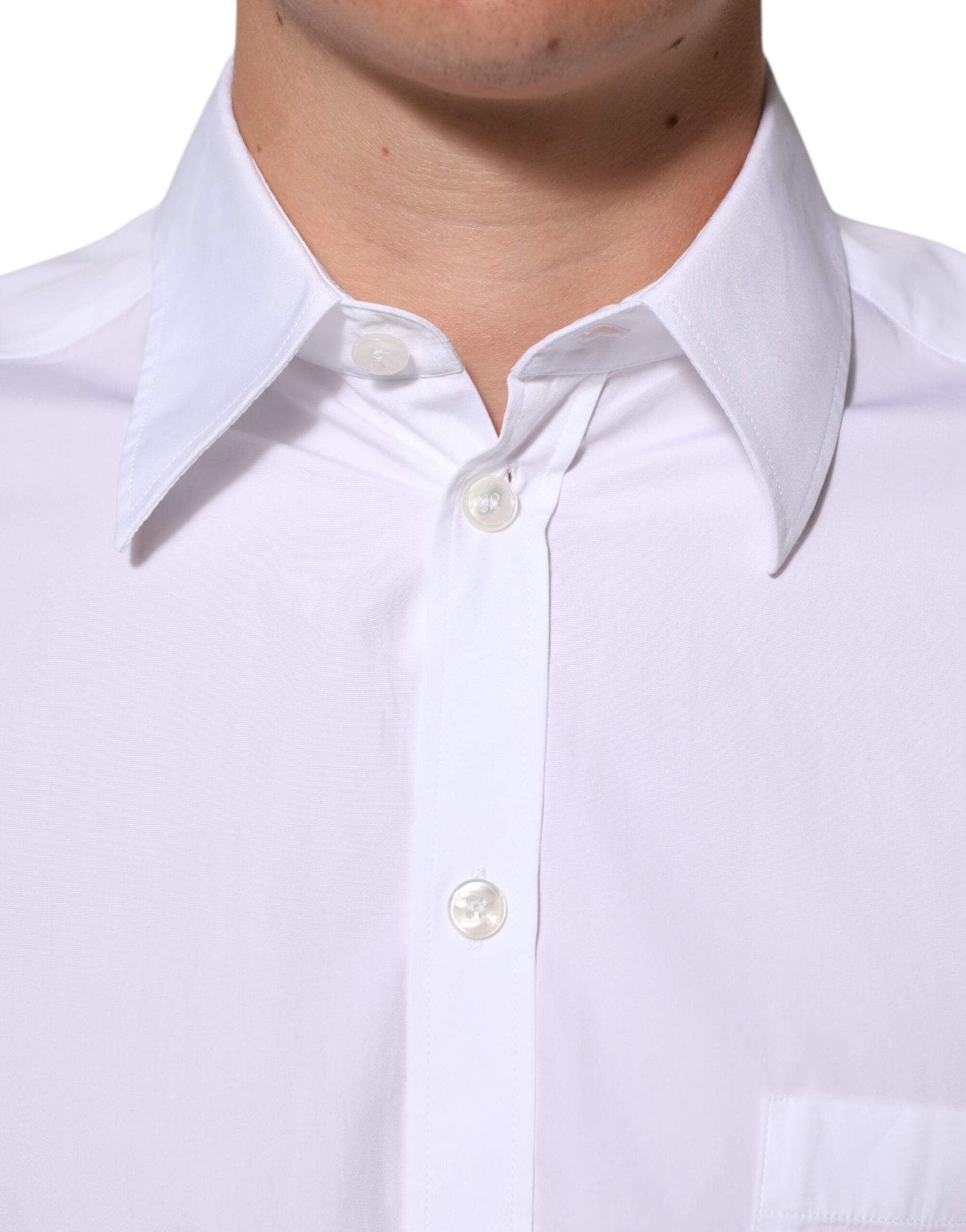 A white collared formal dress shirt with a logo plaque on the left chest