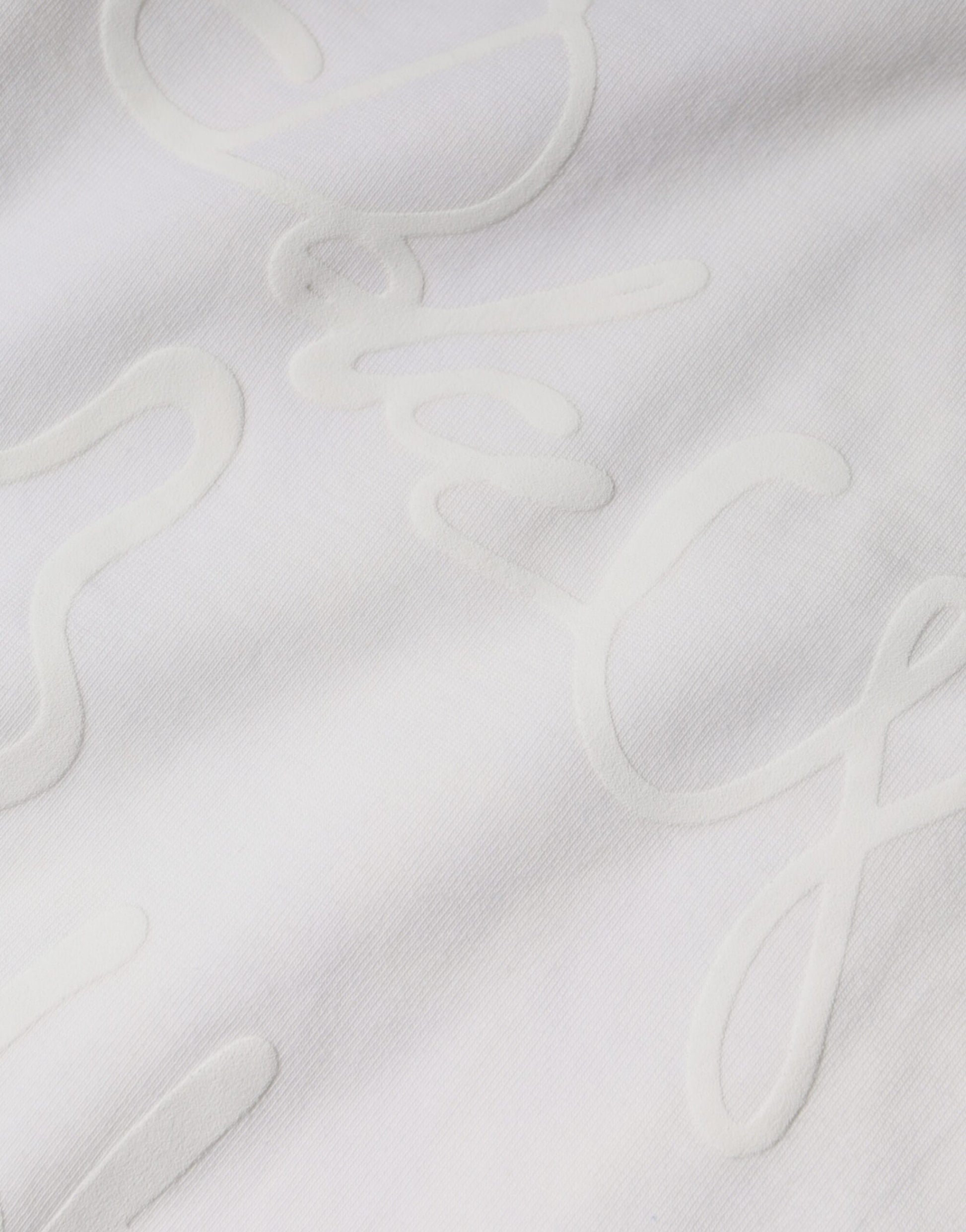 White cloth with embroidered cursive writing