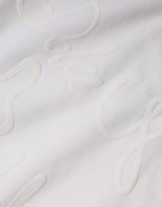 White cloth with embroidered cursive writing