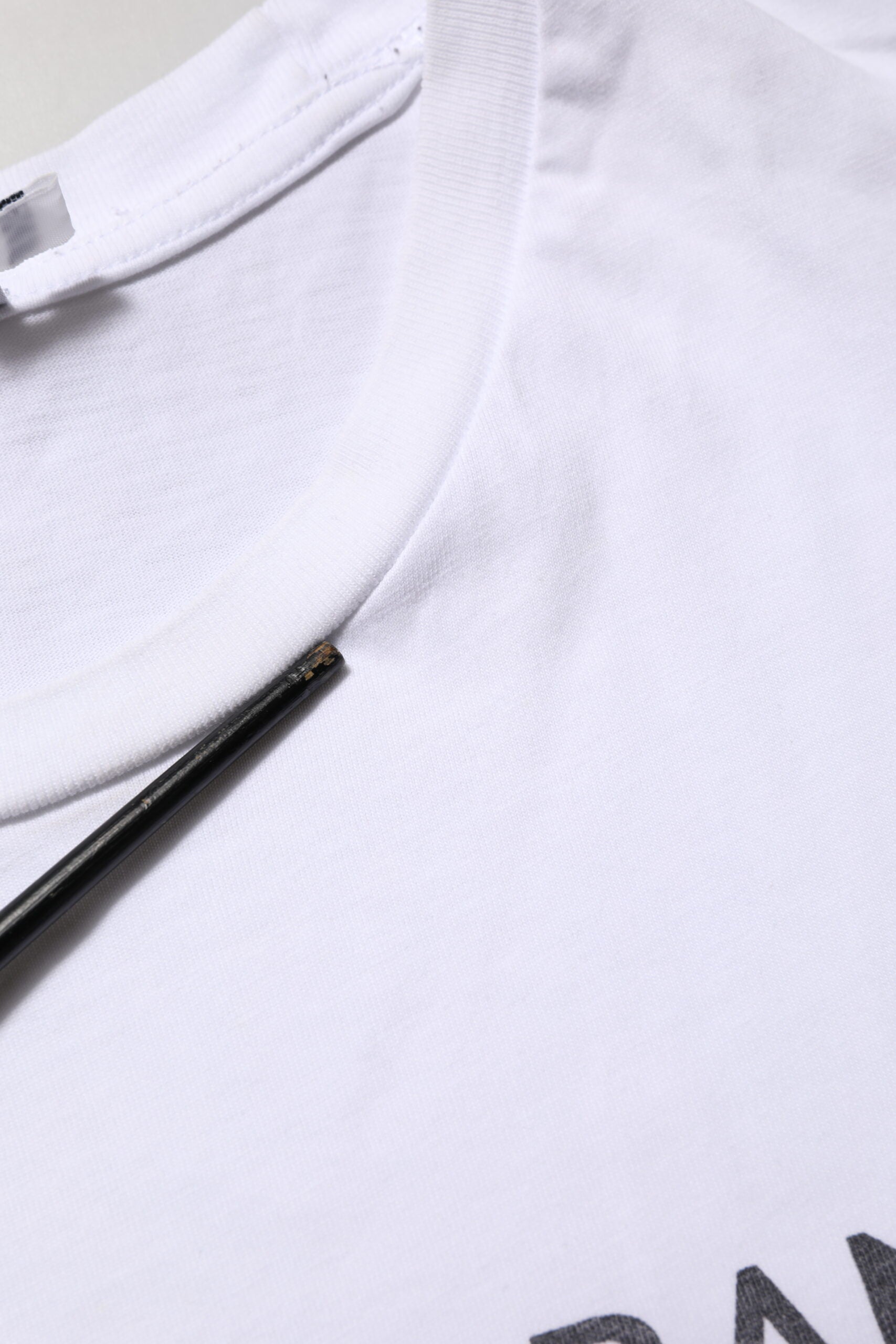 White t-shirt on hanger