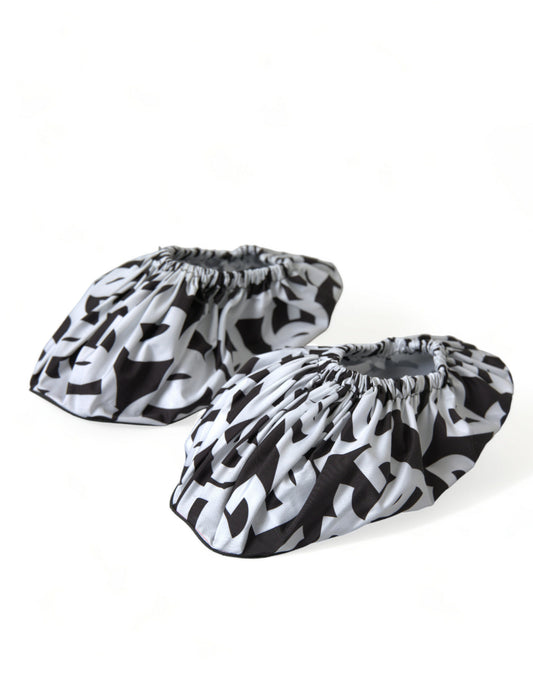 Two black and white patterned cloths with fringe detailing