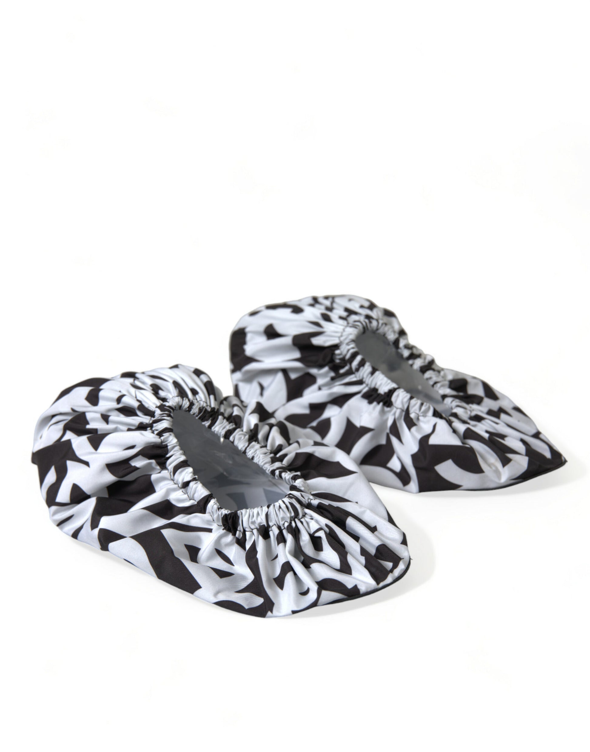 Pair of slippers with black and white patterned fabric