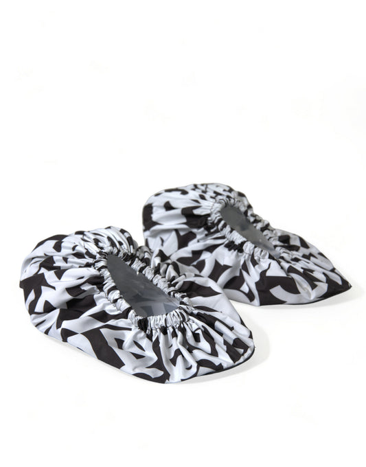 Pair of slippers with black and white patterned fabric