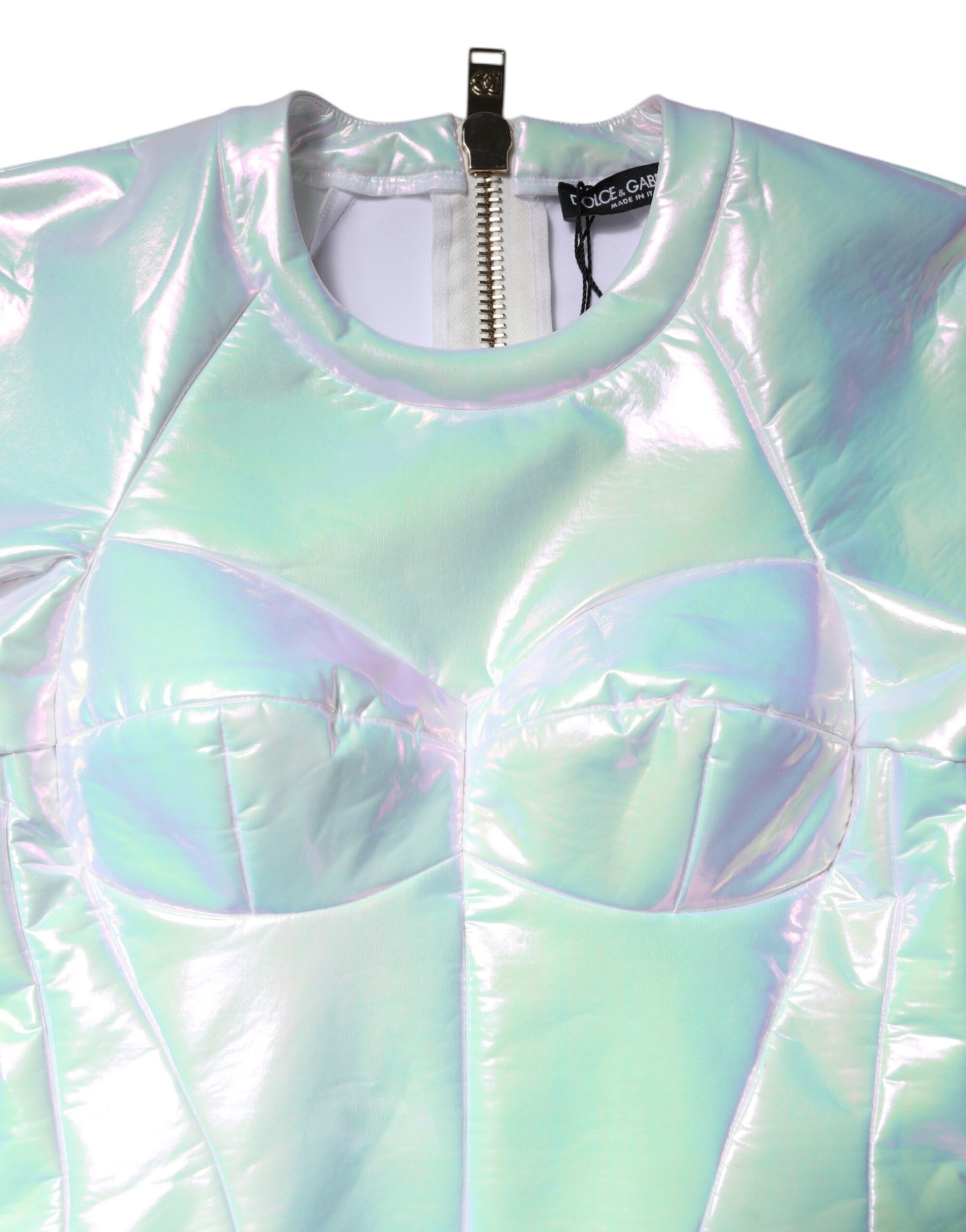 A body-hugging, long sleeve dress with a shiny, metallic finish