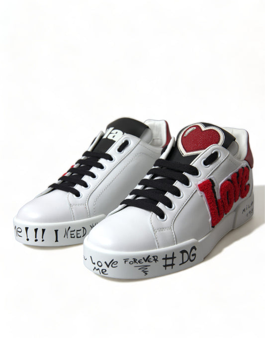 Pair of white sneakers with red and black accents featuring handwritten messages