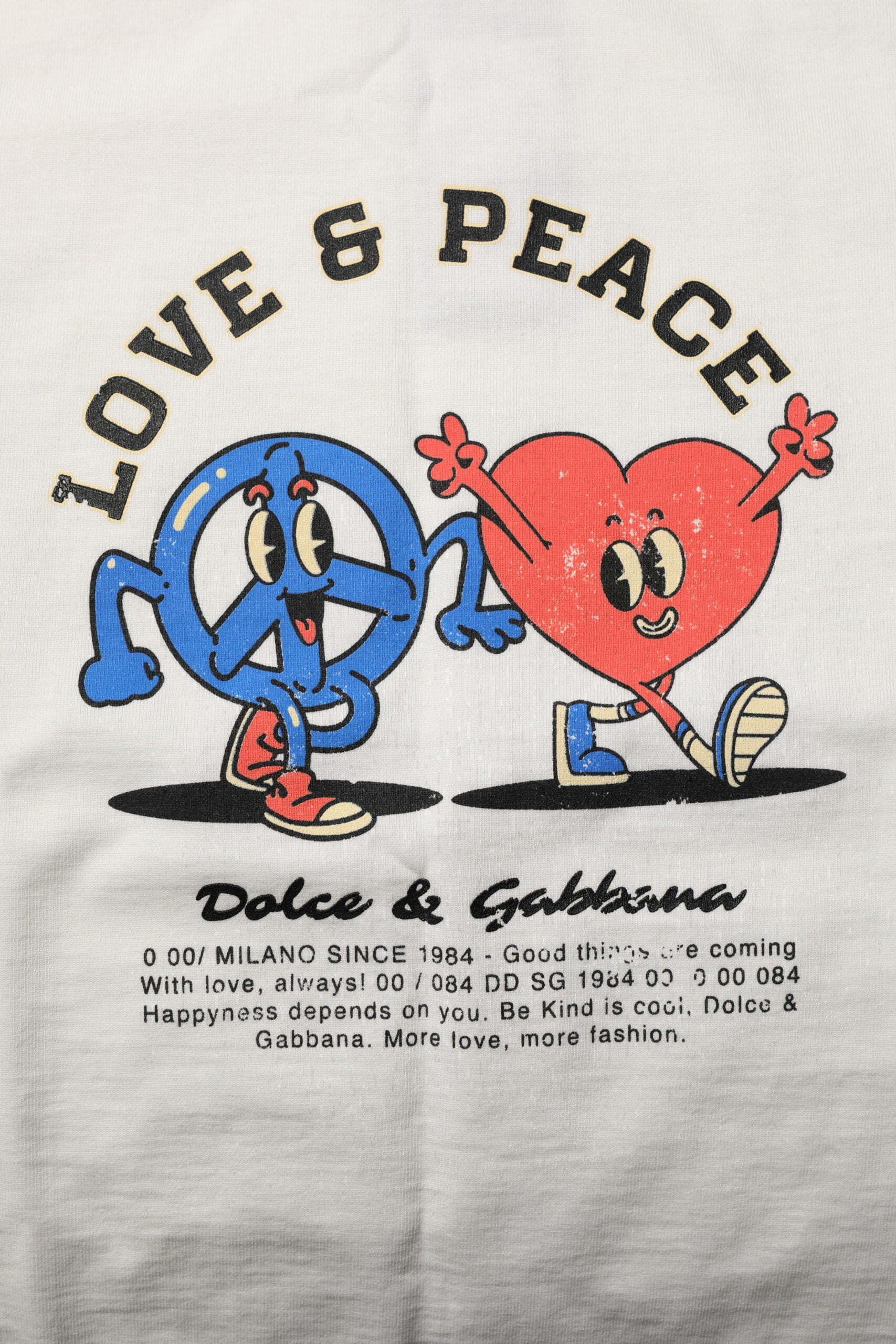 Cartoon graphic on a towel featuring two characters with hearts above their heads