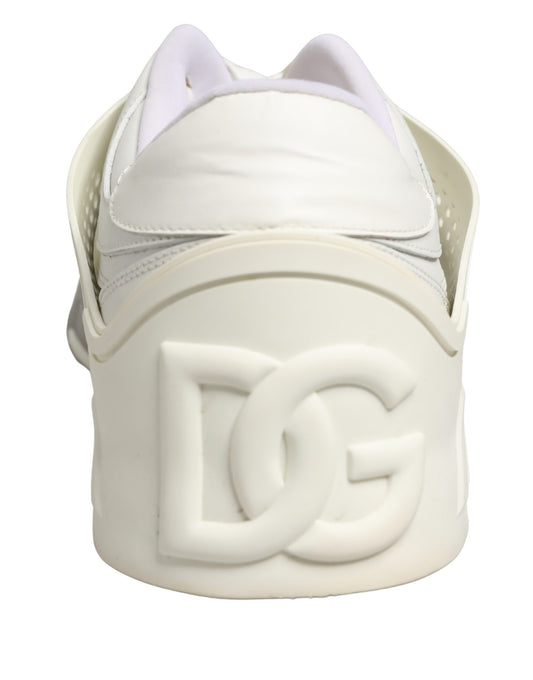 A pair of white low top sneakers with a logo on the side, featuring a custom design by Dolce & Gabbana