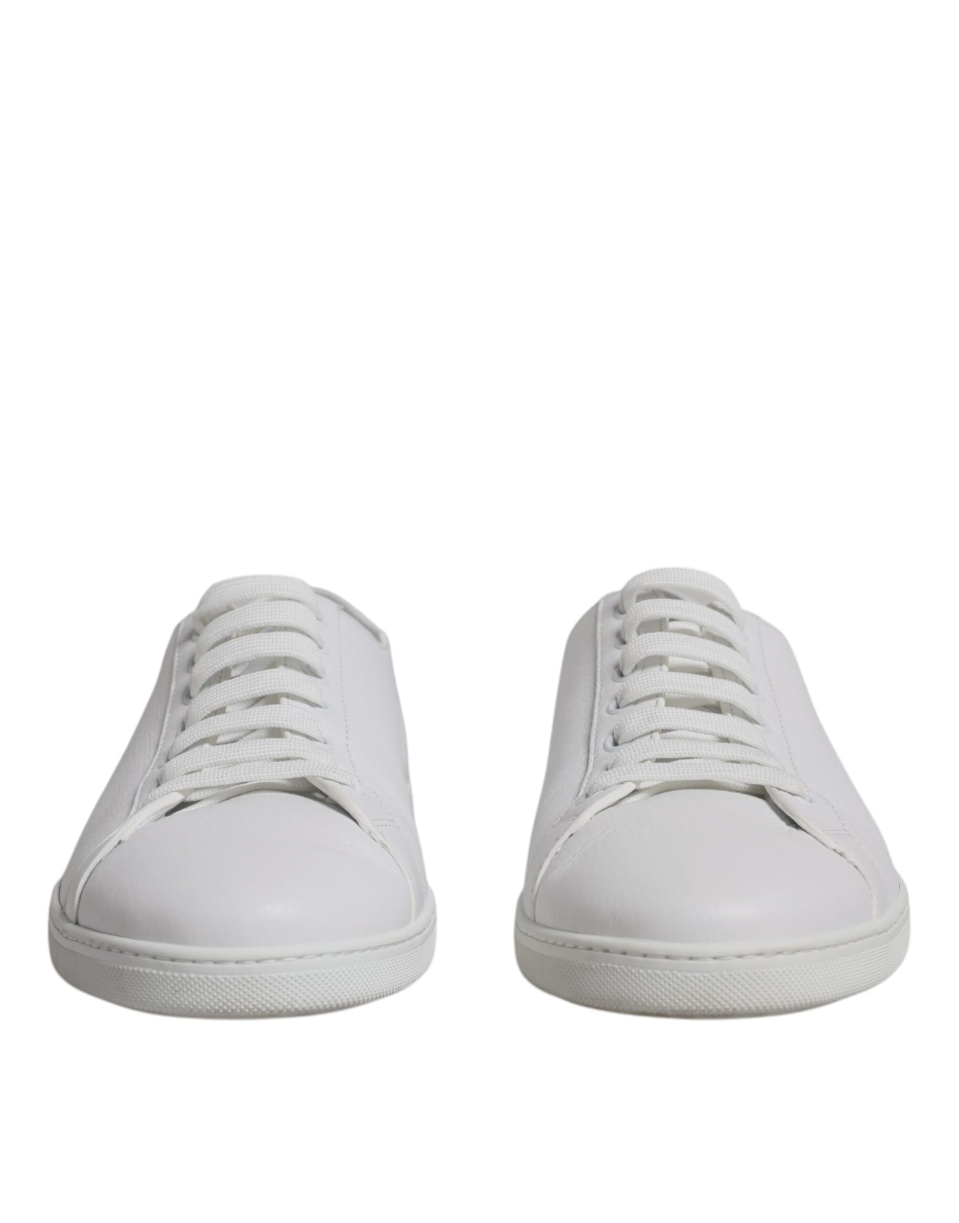 Pair of white sneakers with laces
