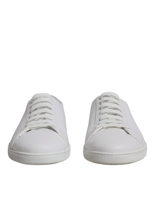 Pair of white sneakers with laces