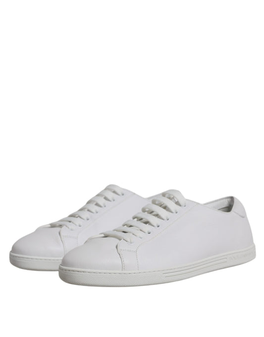 Pair of white sneakers with laces
