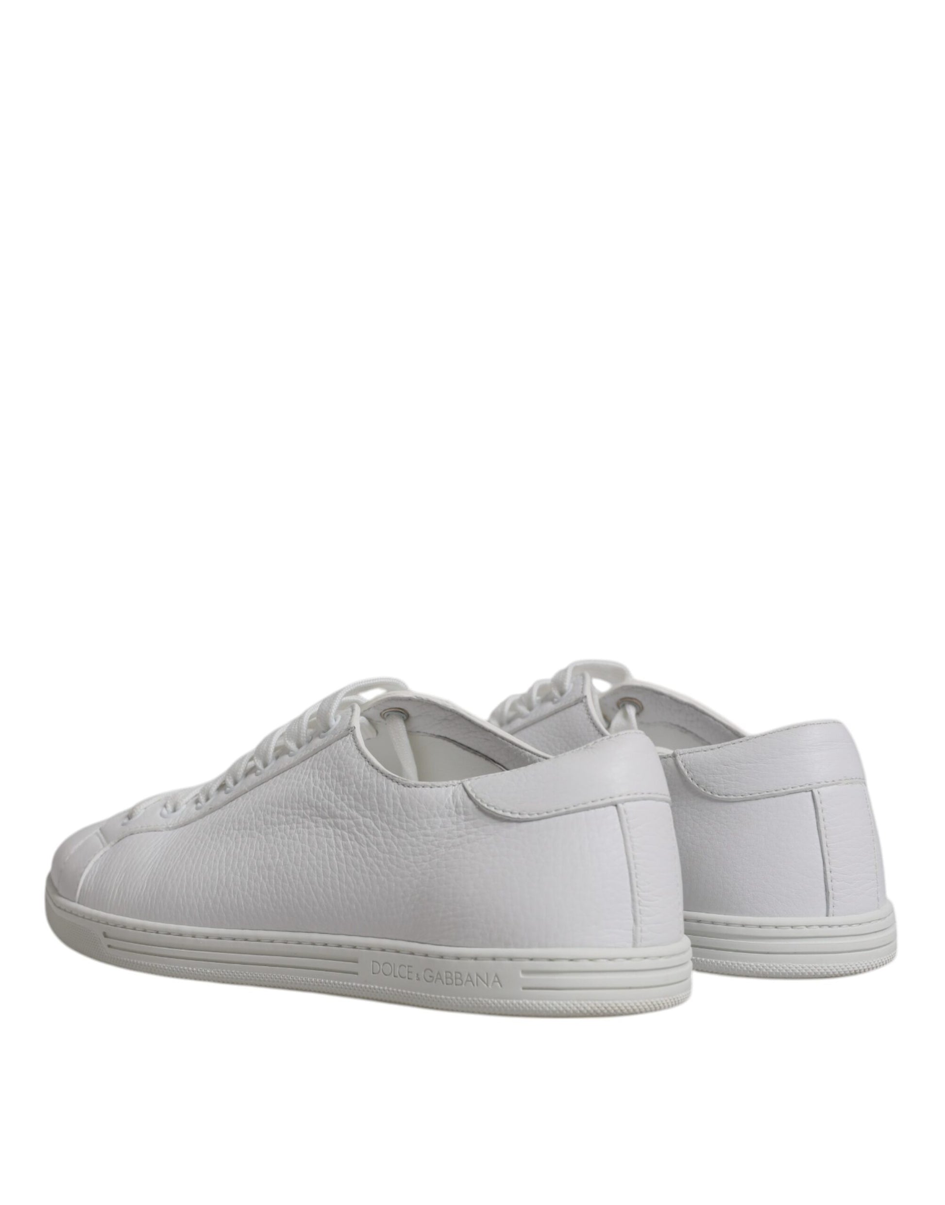 Pair of white sneakers with laces
