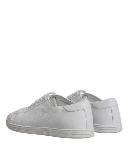 Pair of white sneakers with laces
