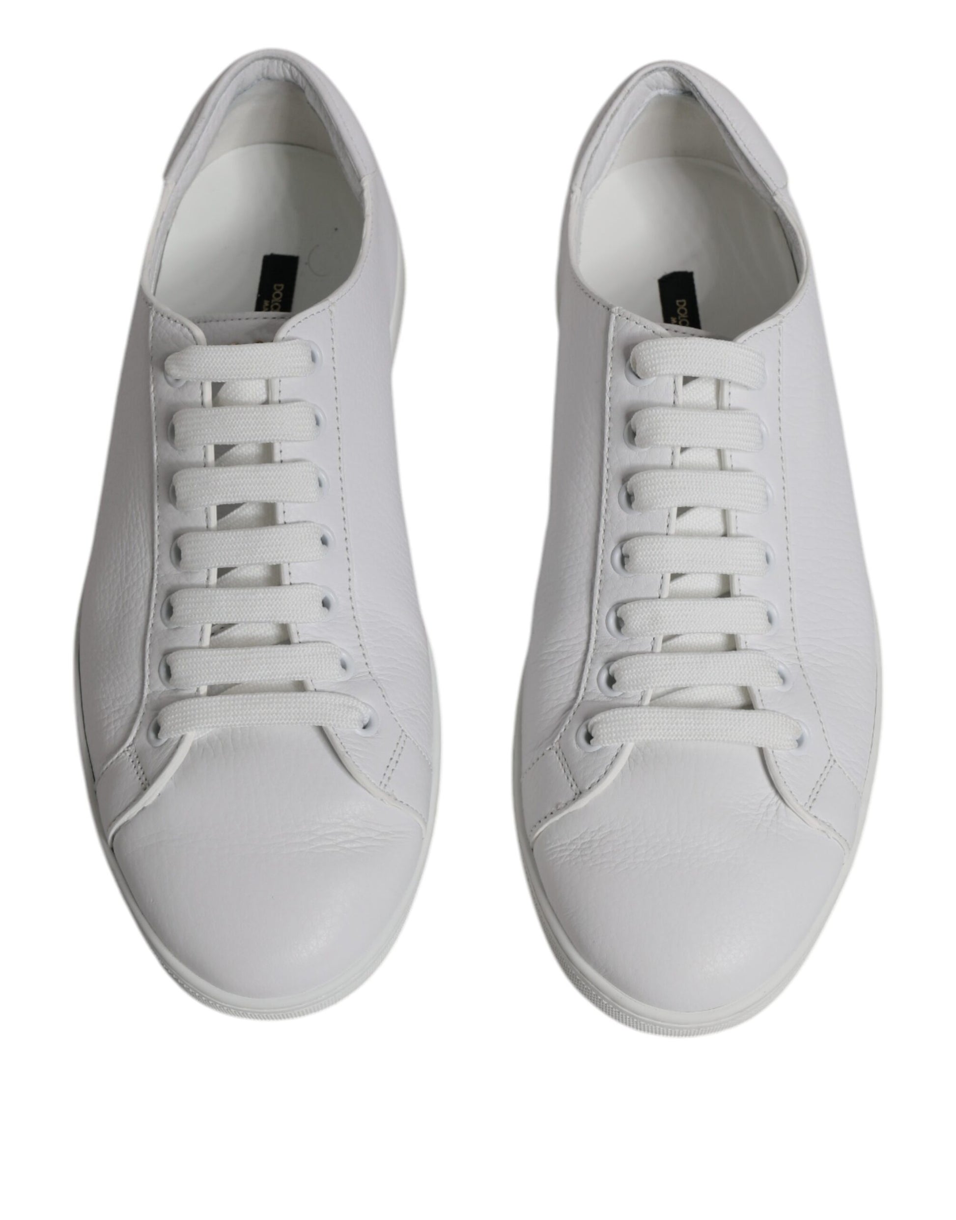 Pair of white sneakers with laces