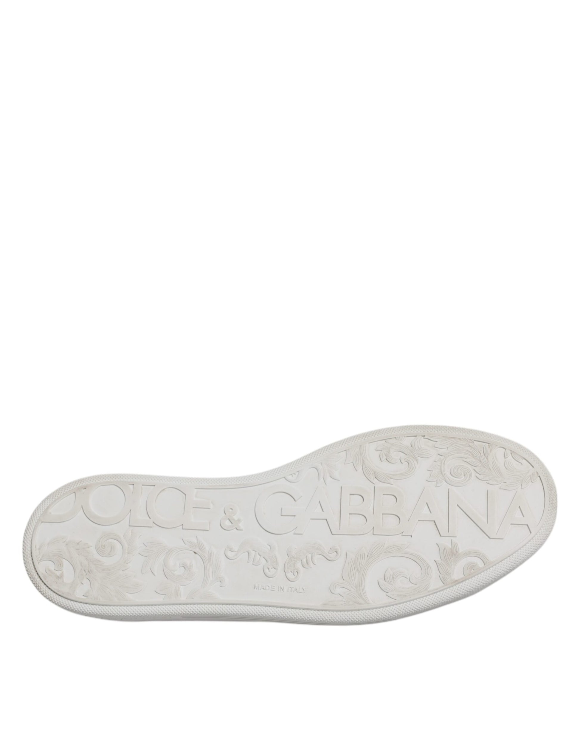 A white low top men's shoe with a decorative pattern and the brand name "Dolce & Gabbana" visible on it