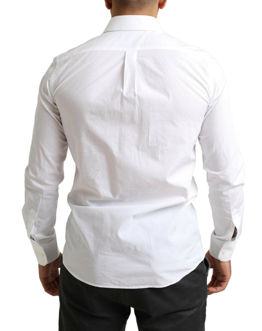A white formal shirt with a collar, long sleeves and a button-up front