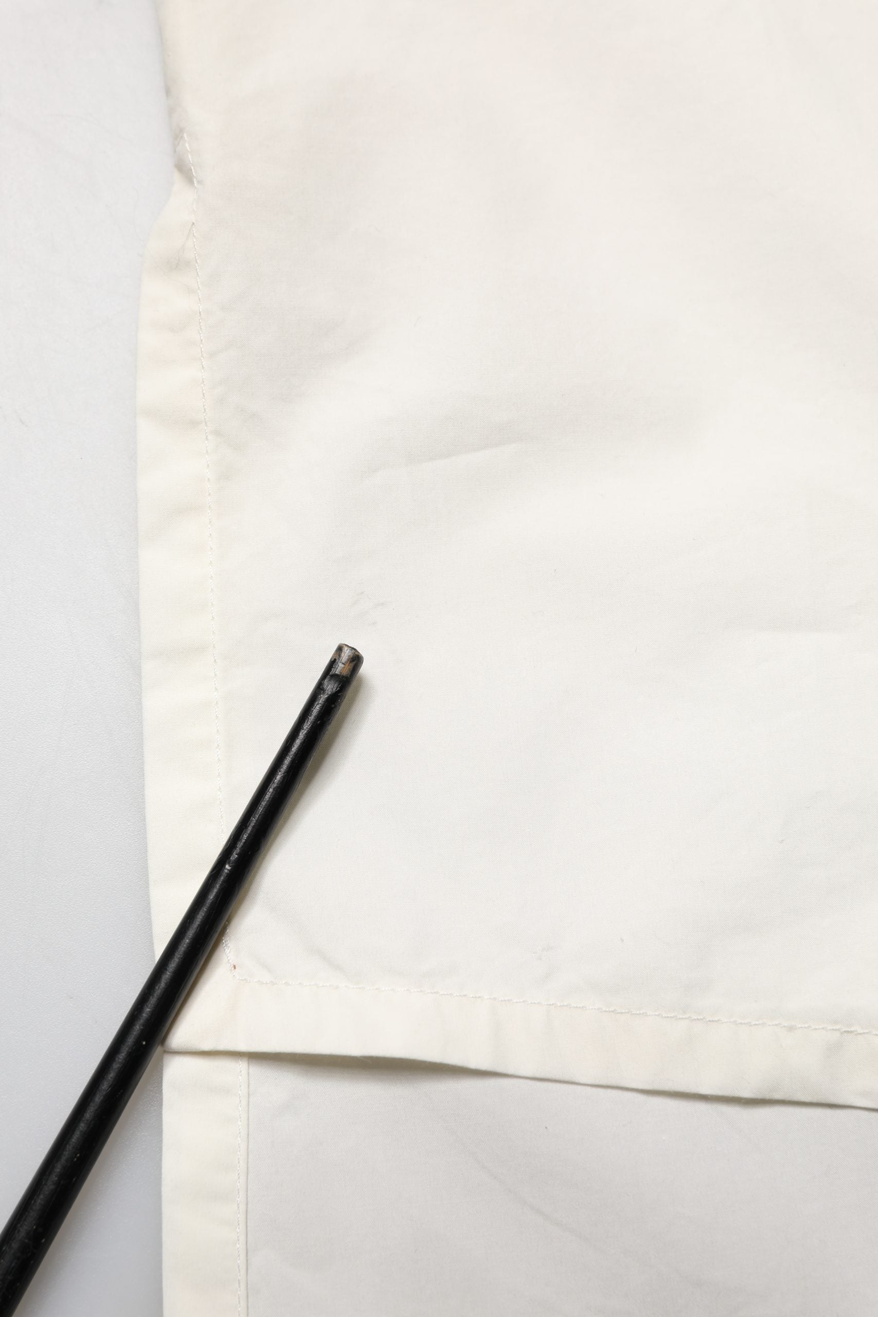 A black tie on a white shirt