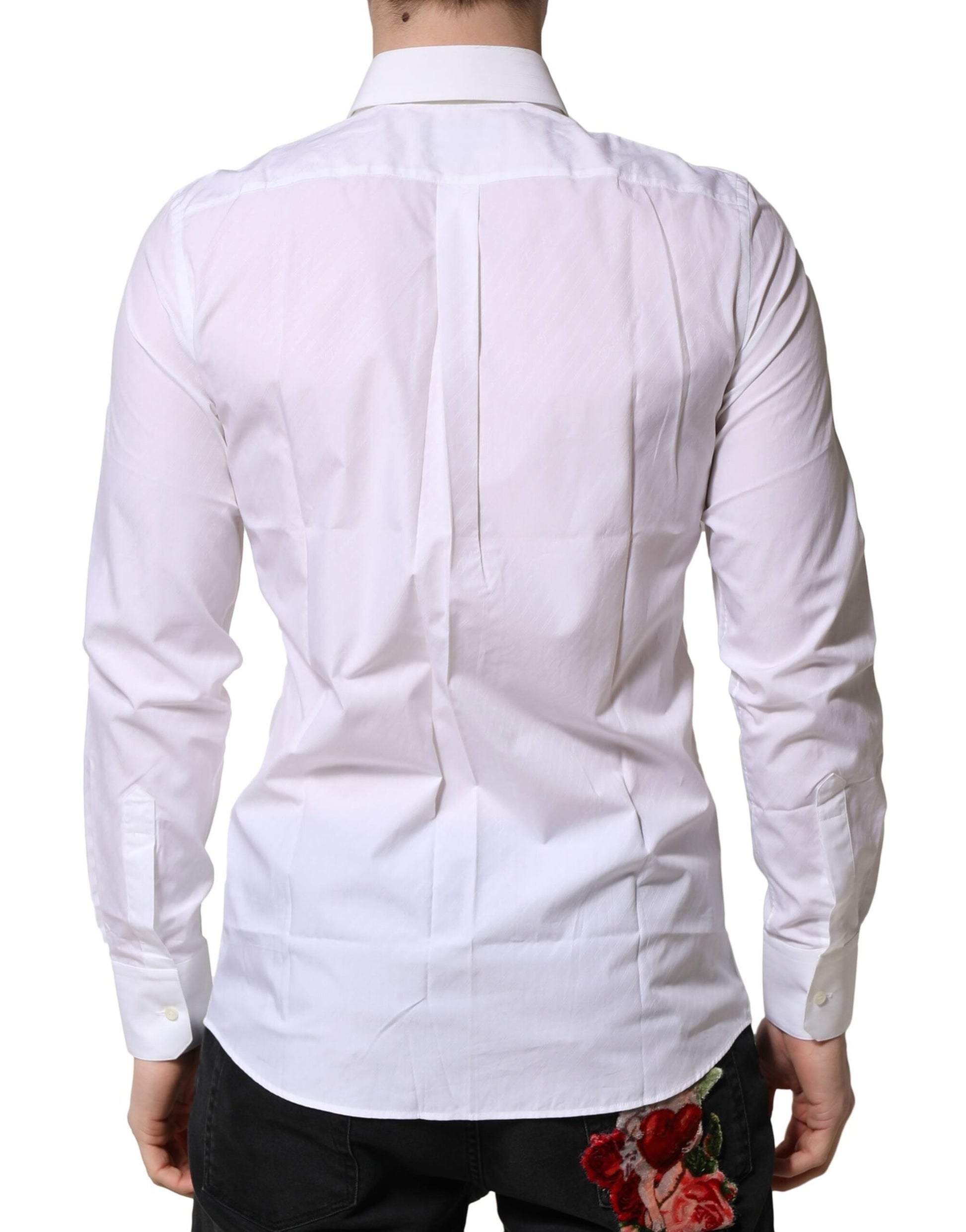 A mannequin wearing a white long sleeve dress shirt with a collar and a red rose on the lapel