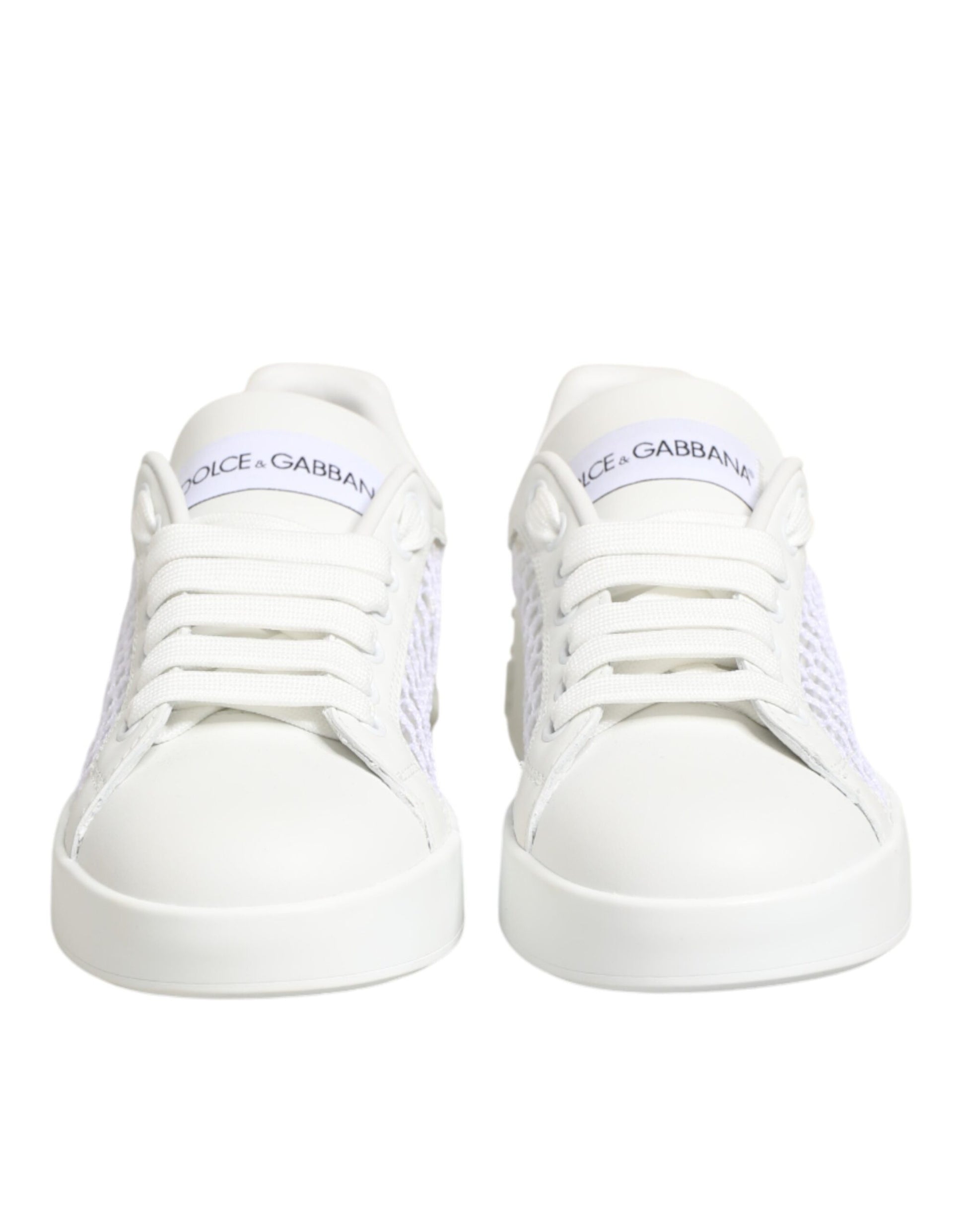 Pair of white sneakers with laces and a logo on the side
