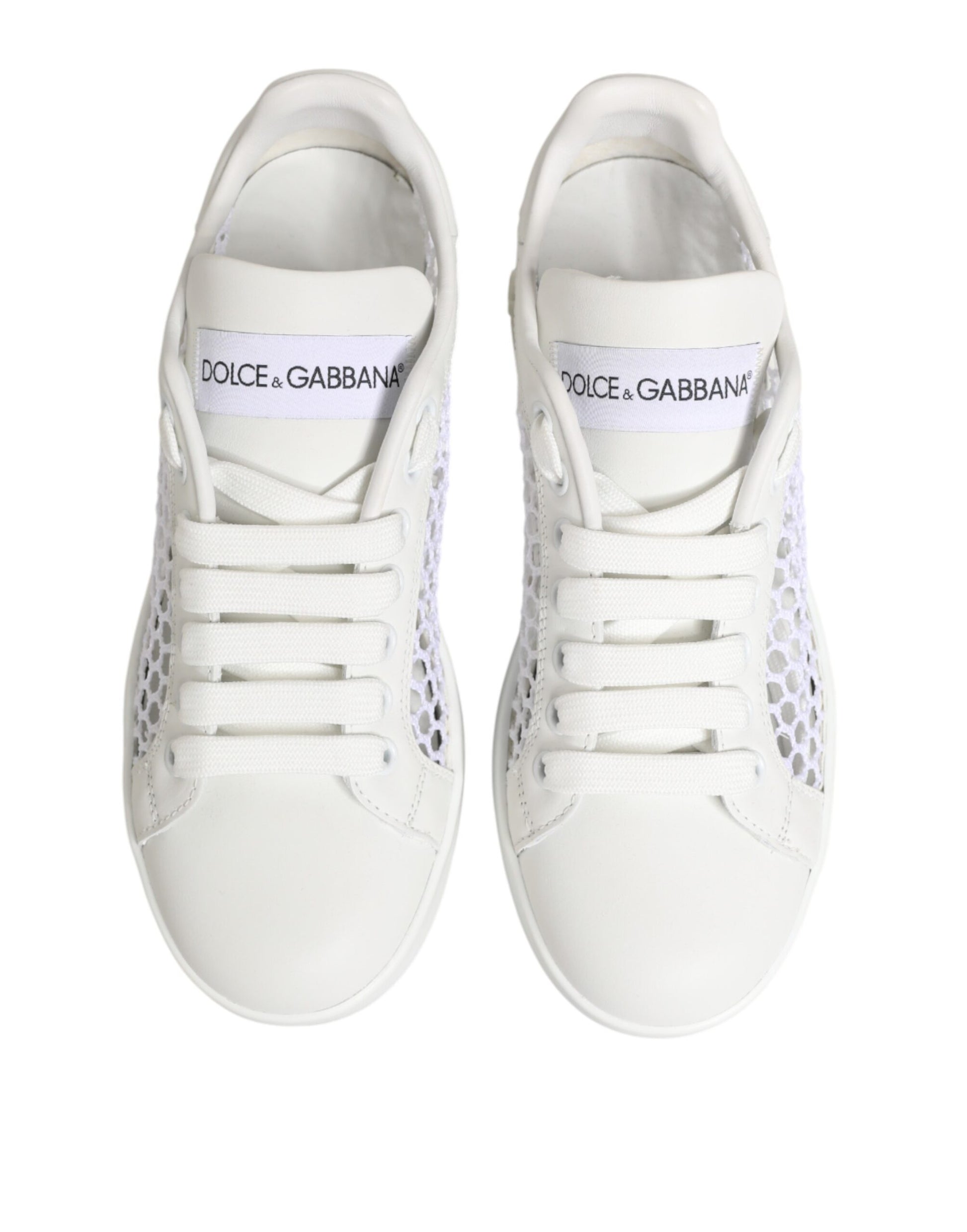 White sneakers with black laces and a logo on the side