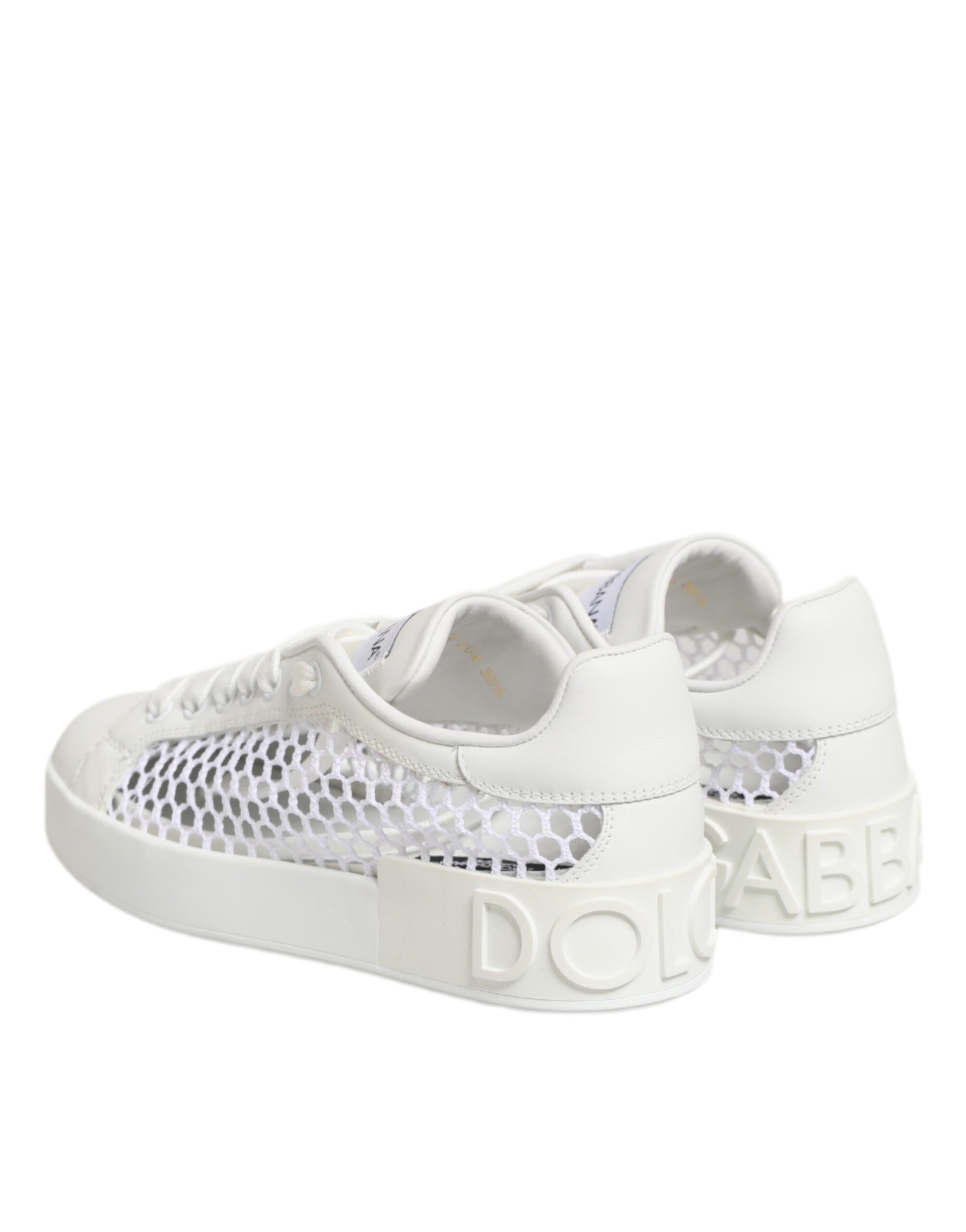 White sneakers with "don't be shy" written on side