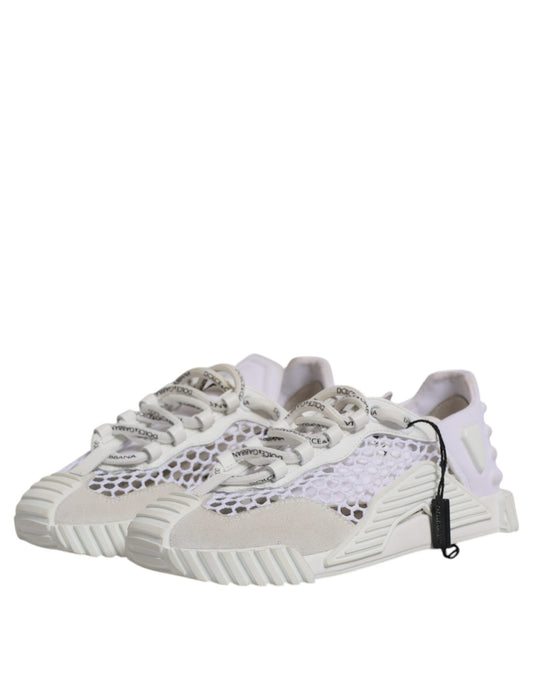 A pair of white mesh sneakers with a low top, featuring the brand name "Dolce & Gabbana" on the side