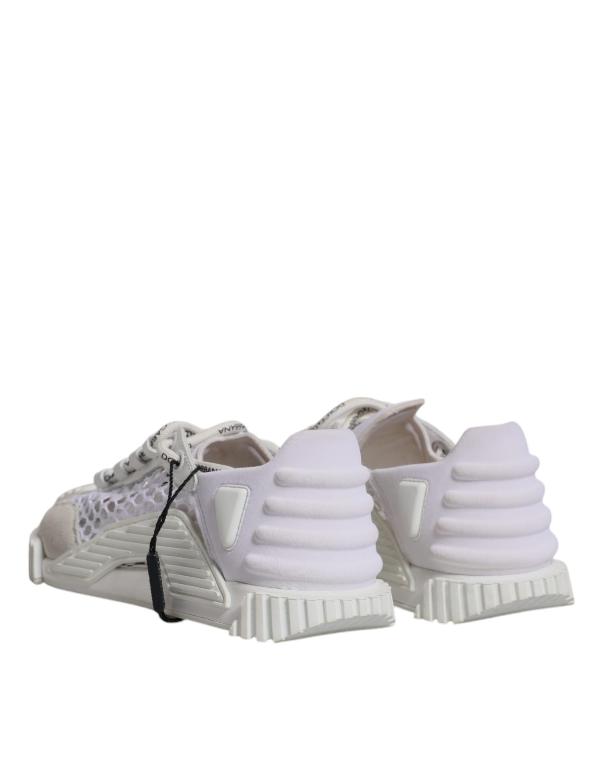 Pair of white mesh sneakers with black laces and soles, featuring a low top design
