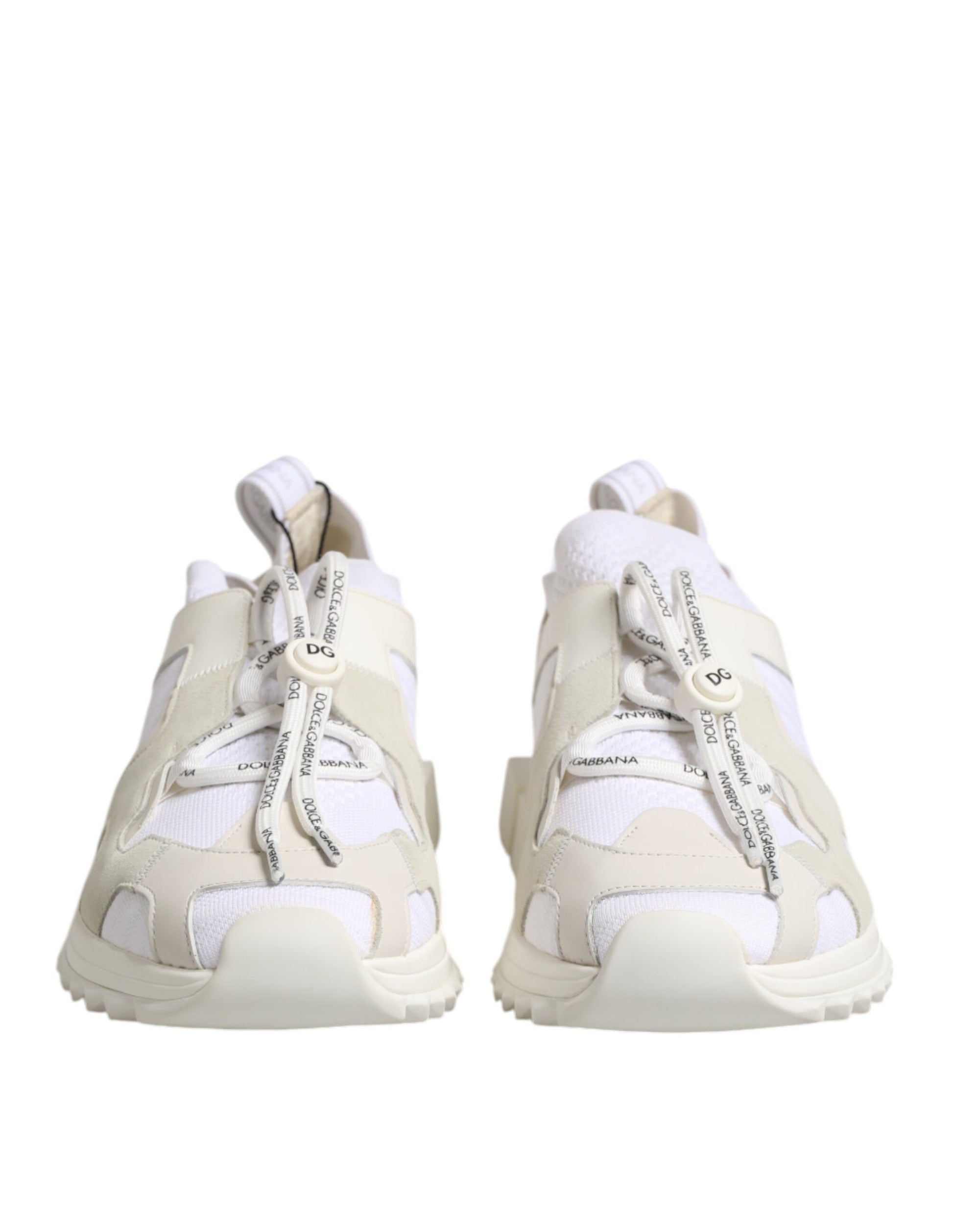 Pair of light beige sneakers with white laces and a small logo on the side