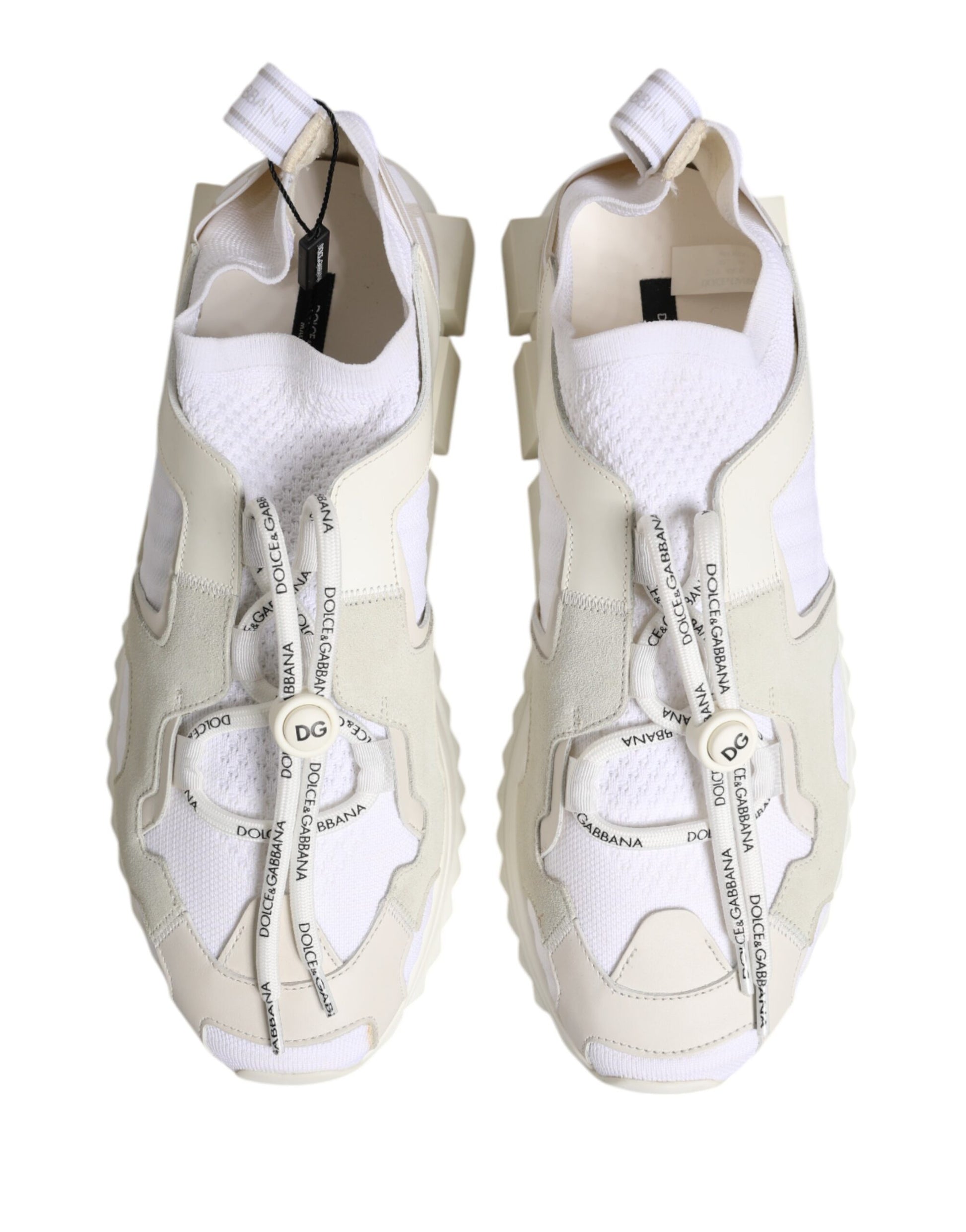 Pair of white sneakers with black laces