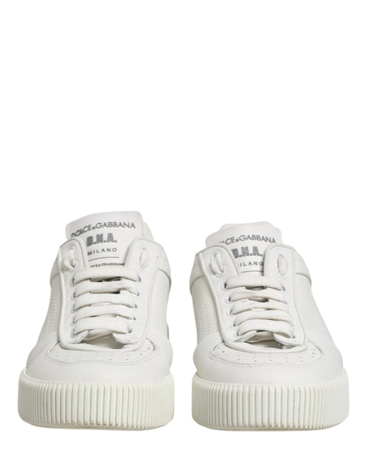 Pair of white men's sneakers with brand name on side