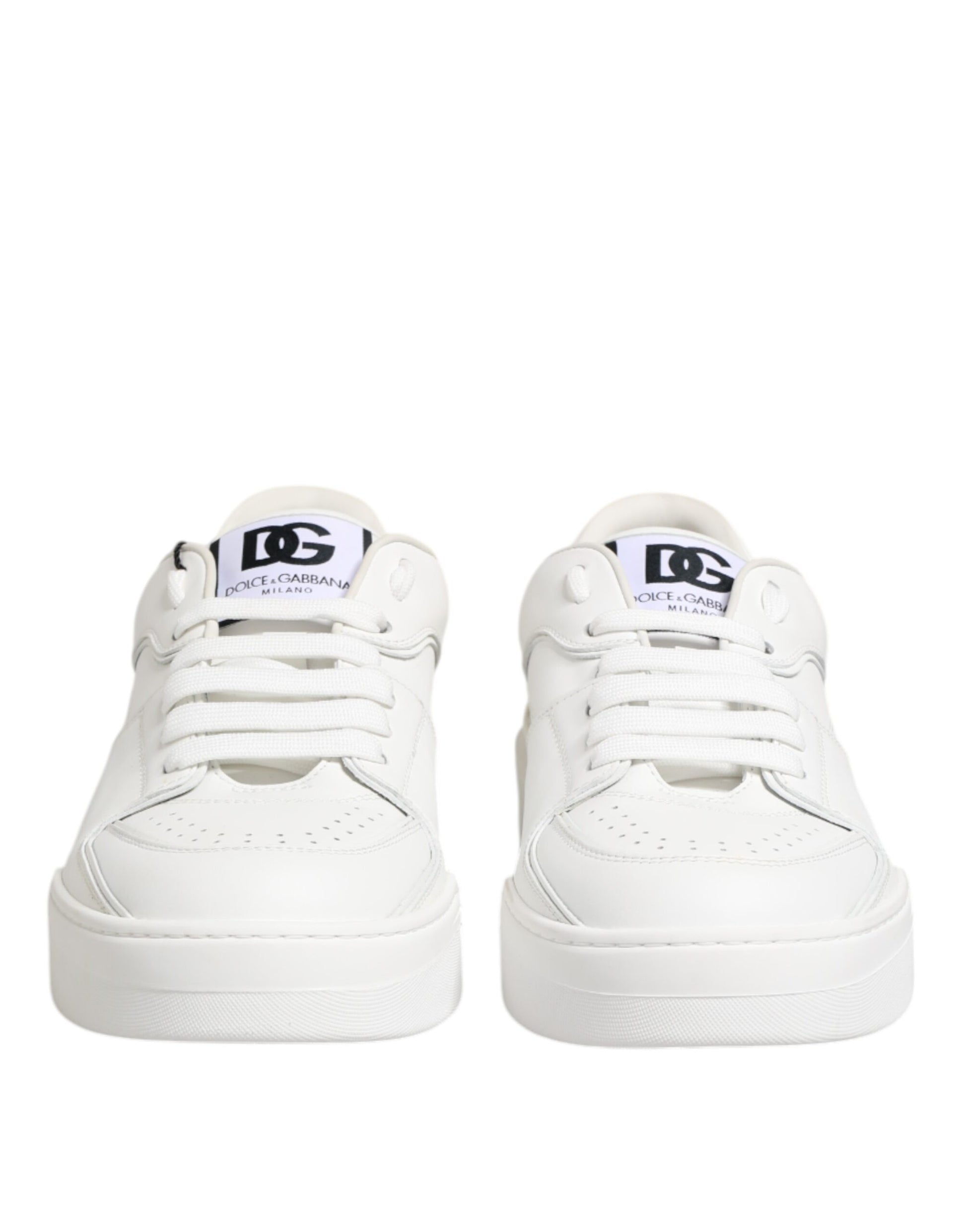 White leather low top sneakers with black laces and logo tag on tongue