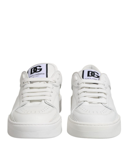 Pair of white leather sneakers with black laces and logo, featuring low top design