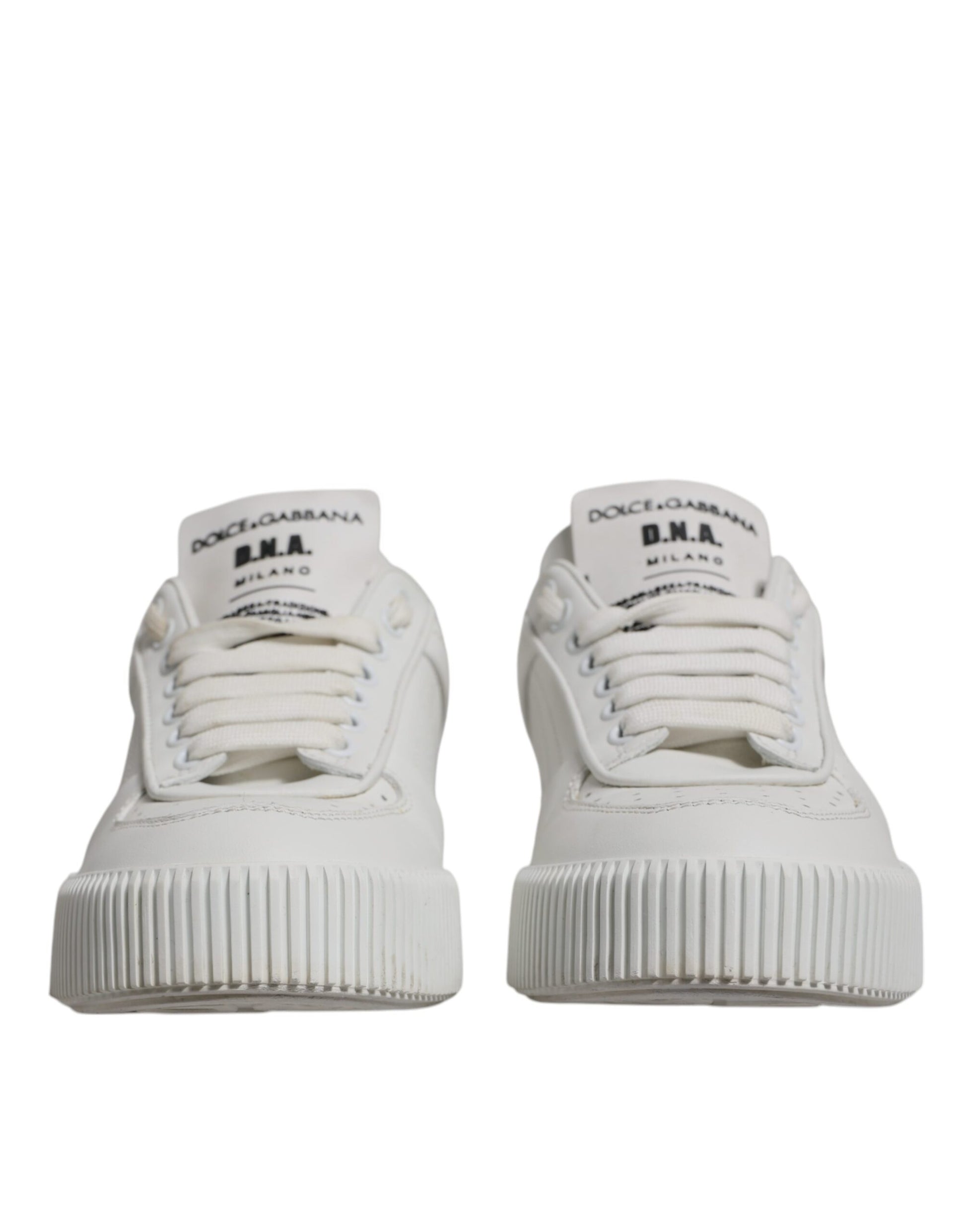 Pair of white sneakers with black laces and soles