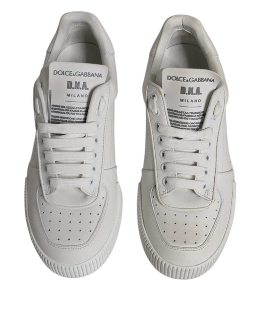 Pair of white leather sneakers with black laces and logo, featuring a low top design