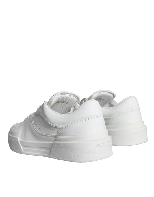 Pair of white leather sneakers with low top, featuring a logo on the side and a lace-up front