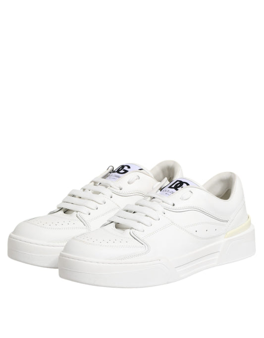 Pair of white leather sneakers with low top, featuring a logo on the side and a chunky sole