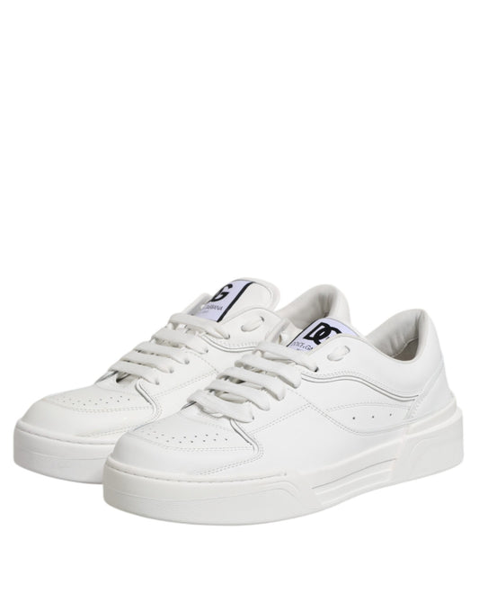White leather low top sneakers with black laces and logo on side
