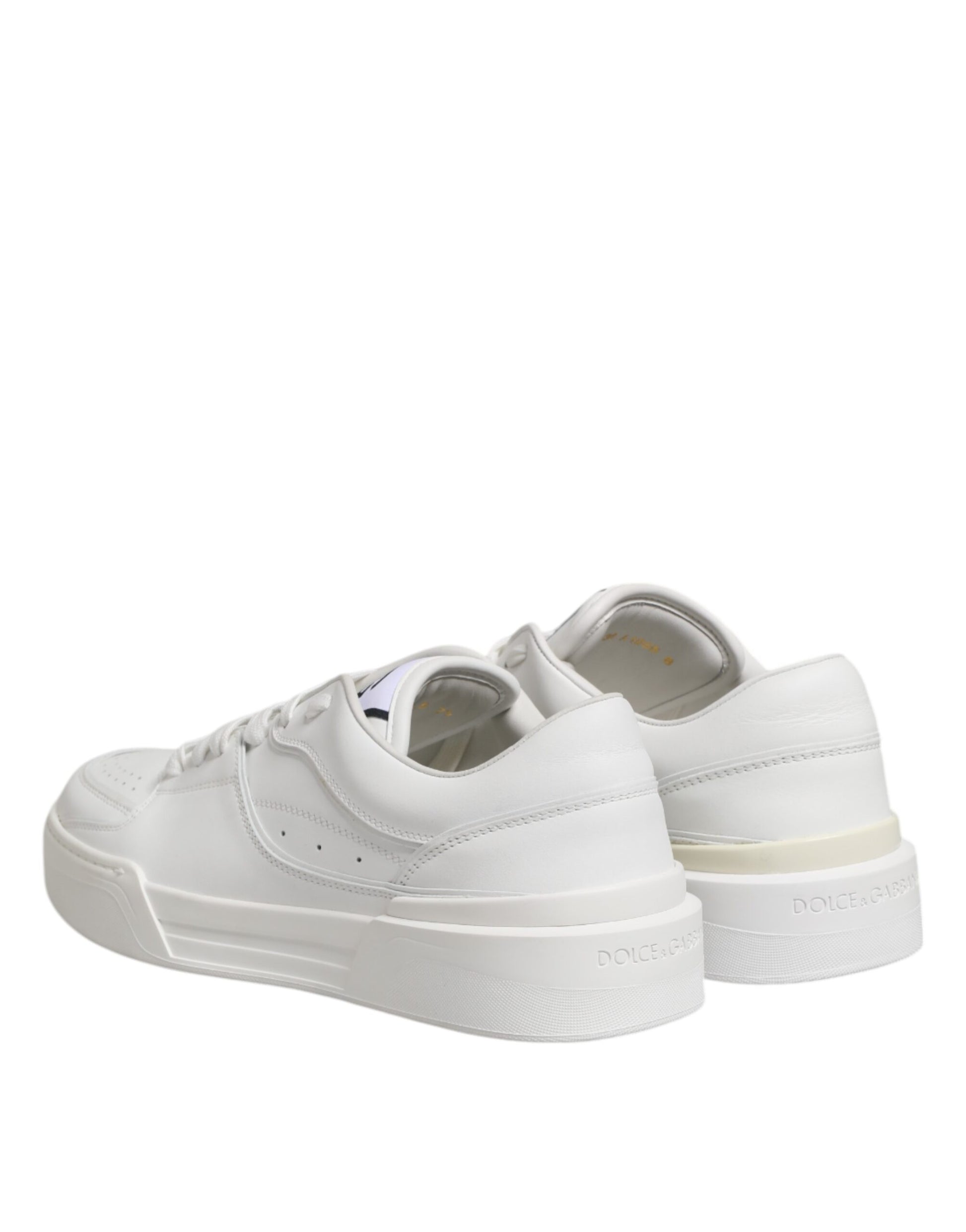 Pair of white leather sneakers with low top, featuring a logo on the side and a strap across the foot