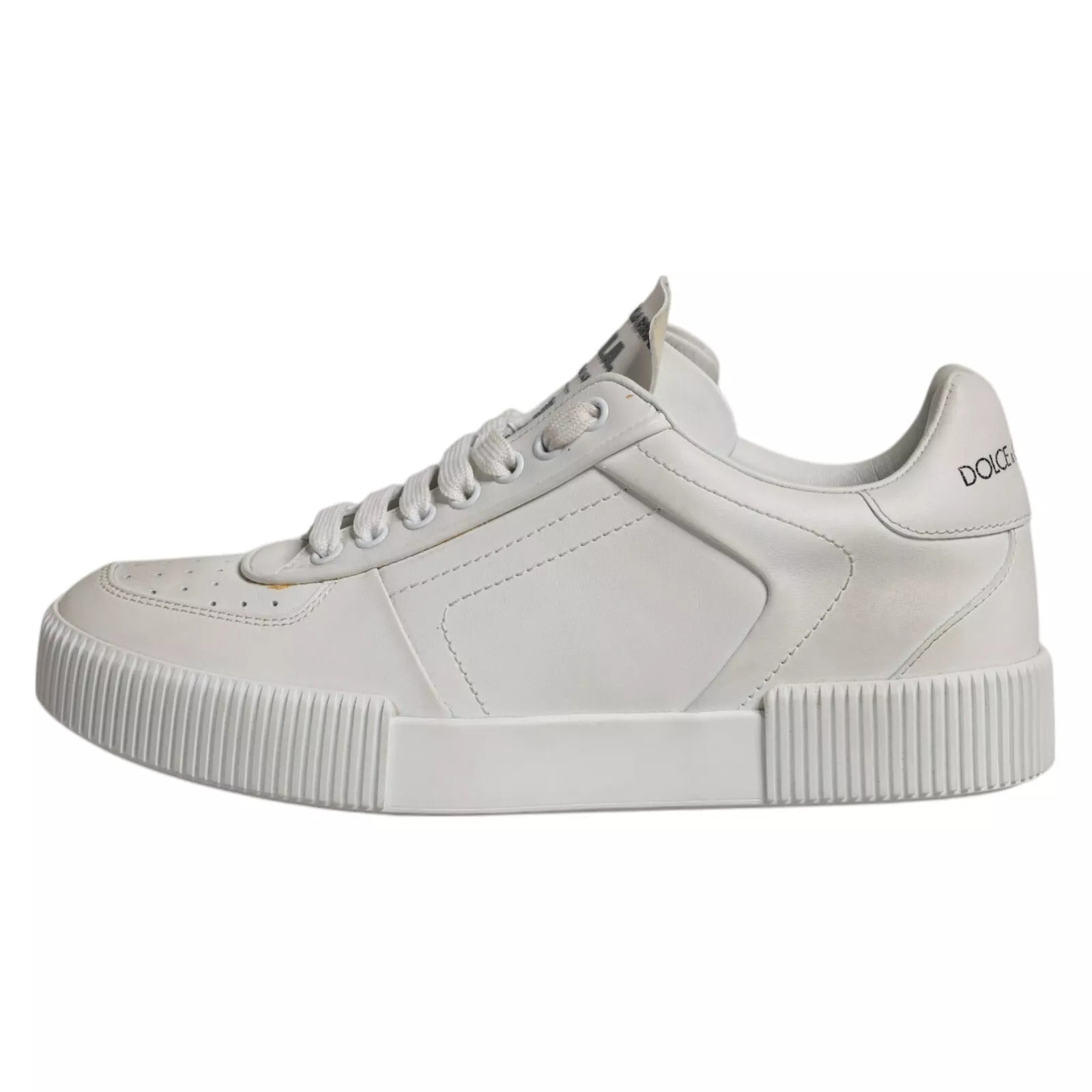 White sneaker with white laces and a black logo on side