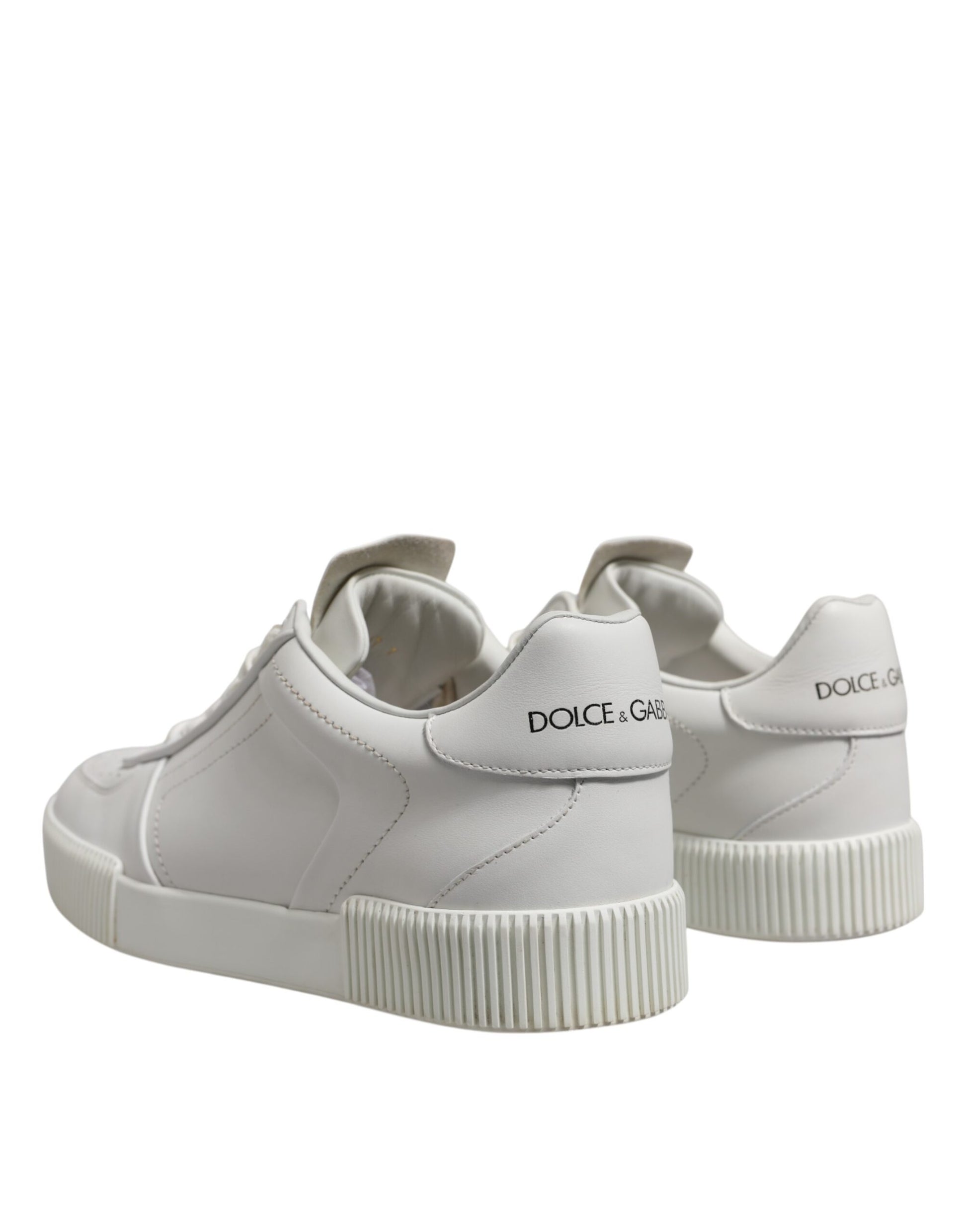 Pair of white leather sneakers with low top, featuring a chunky sole and brand name on side