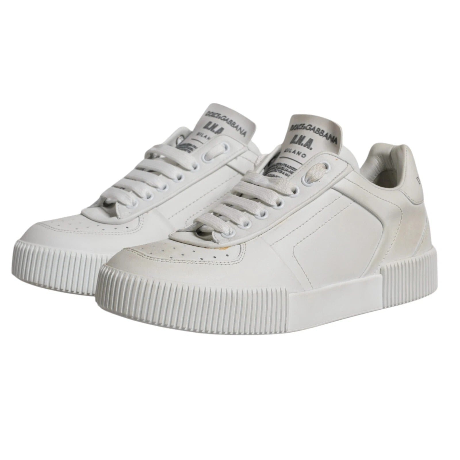 Pair of white sneakers with laces
